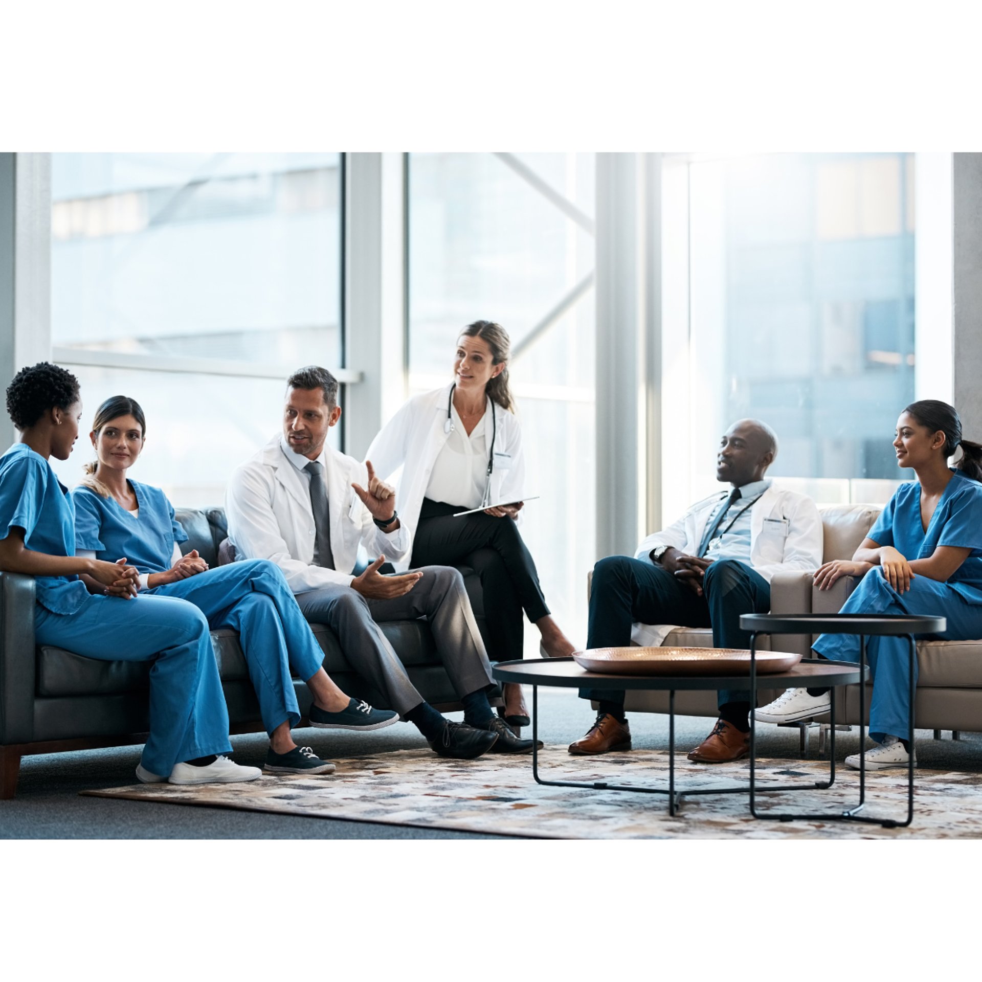 Team of healthcare providers discussing patient care in a Saudi hospital.