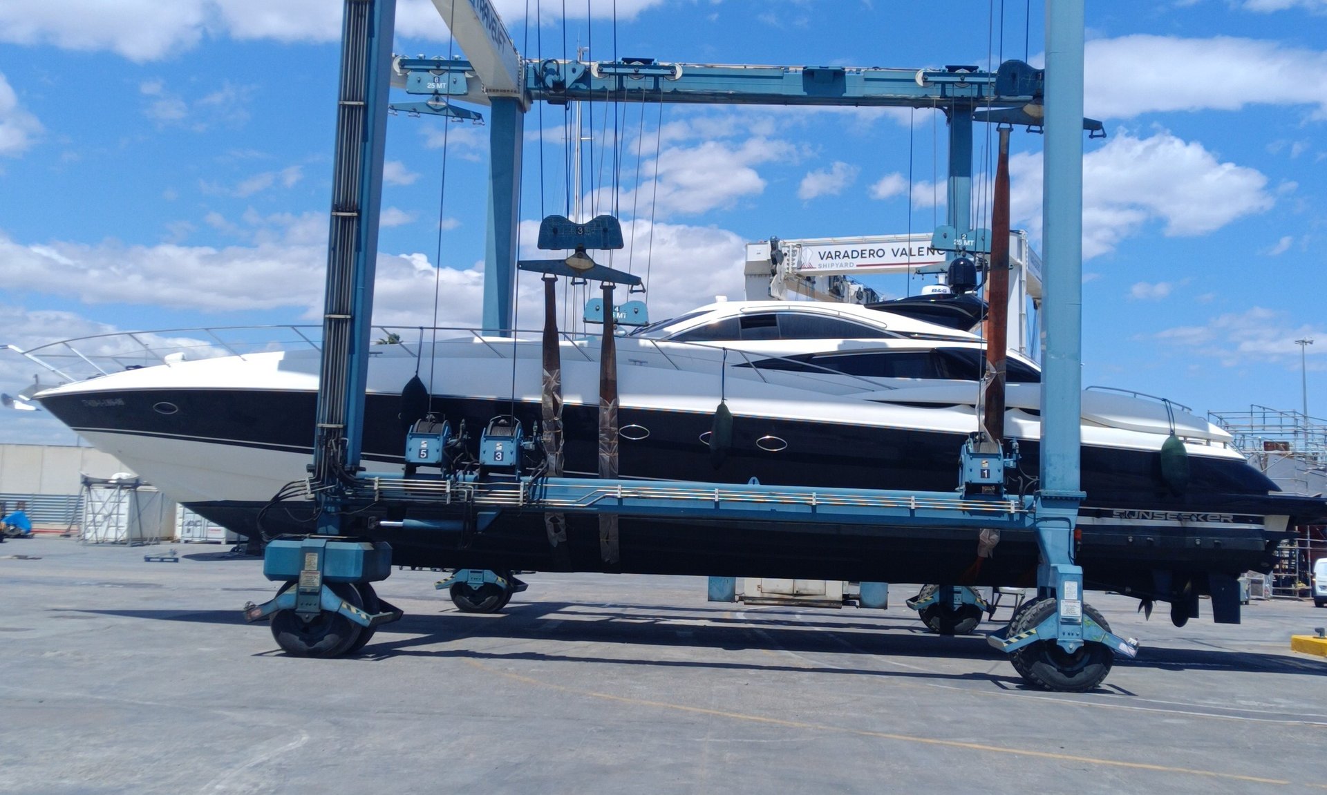 a large white boat is docked at a dock