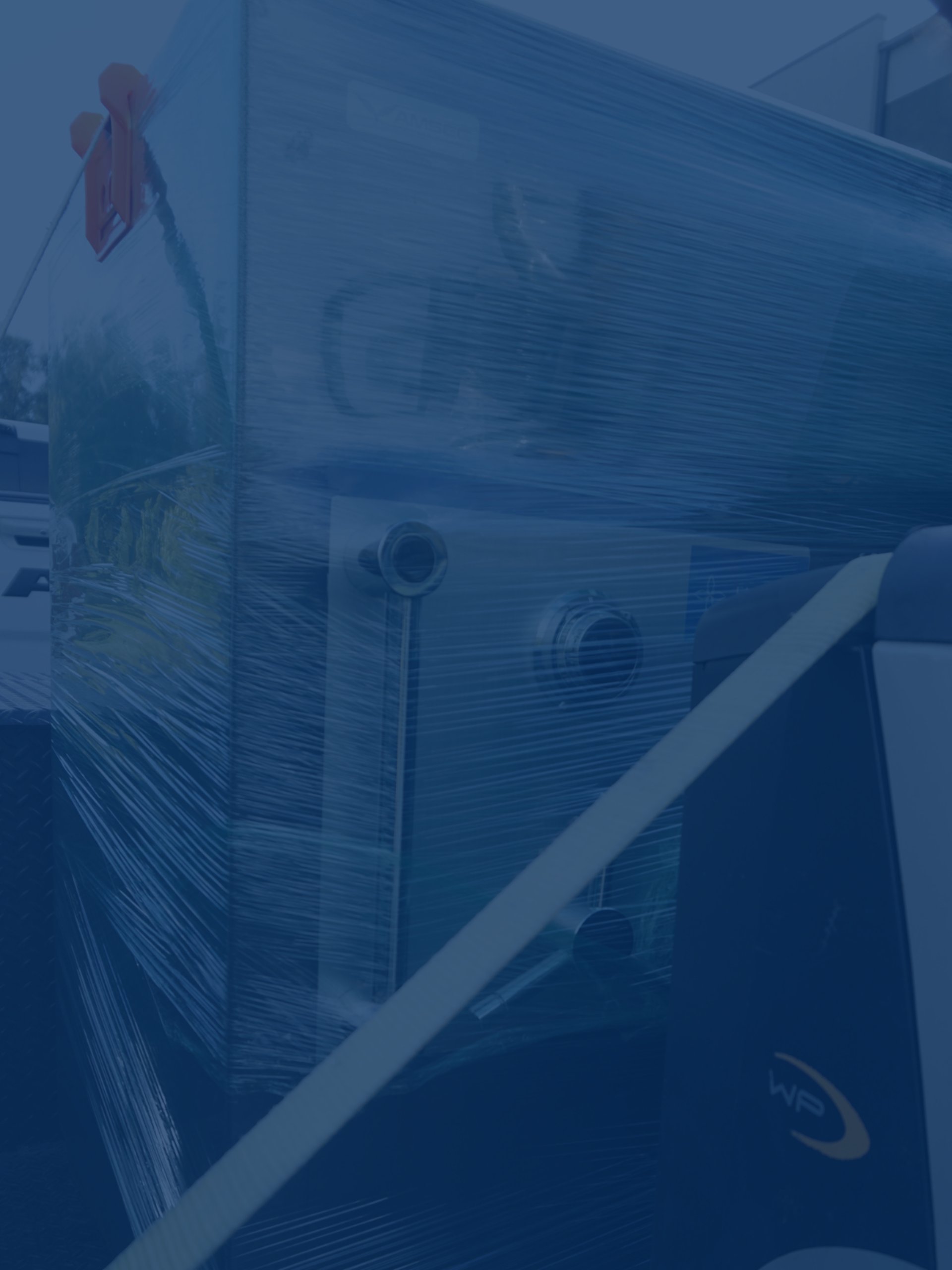 an abstract photo of a curved building with a blue sky in the background