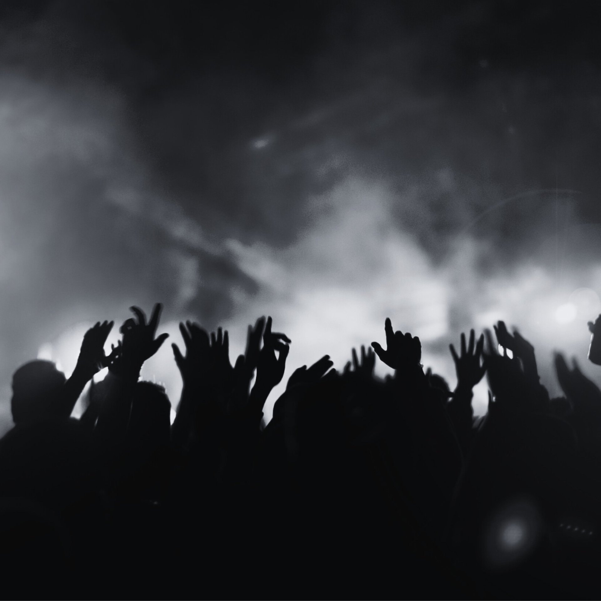 woman in black tank top sitting on brown wooden bench