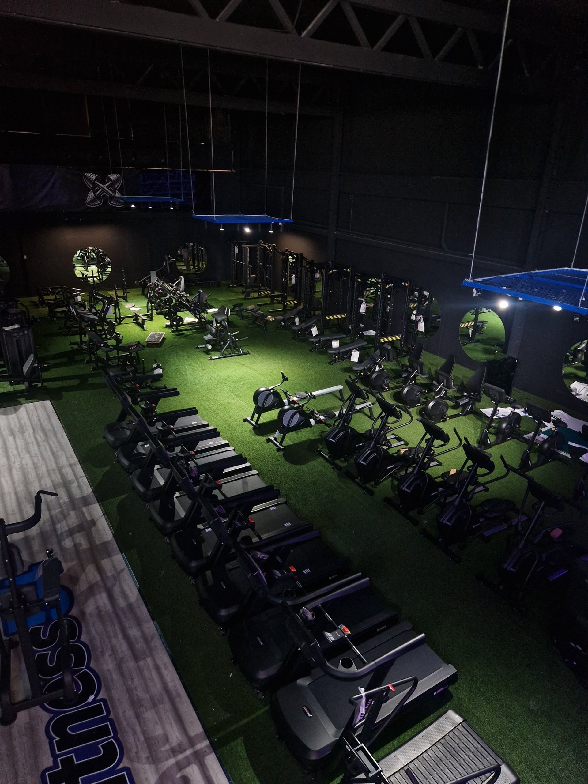 a man running on a treadmill in a gym