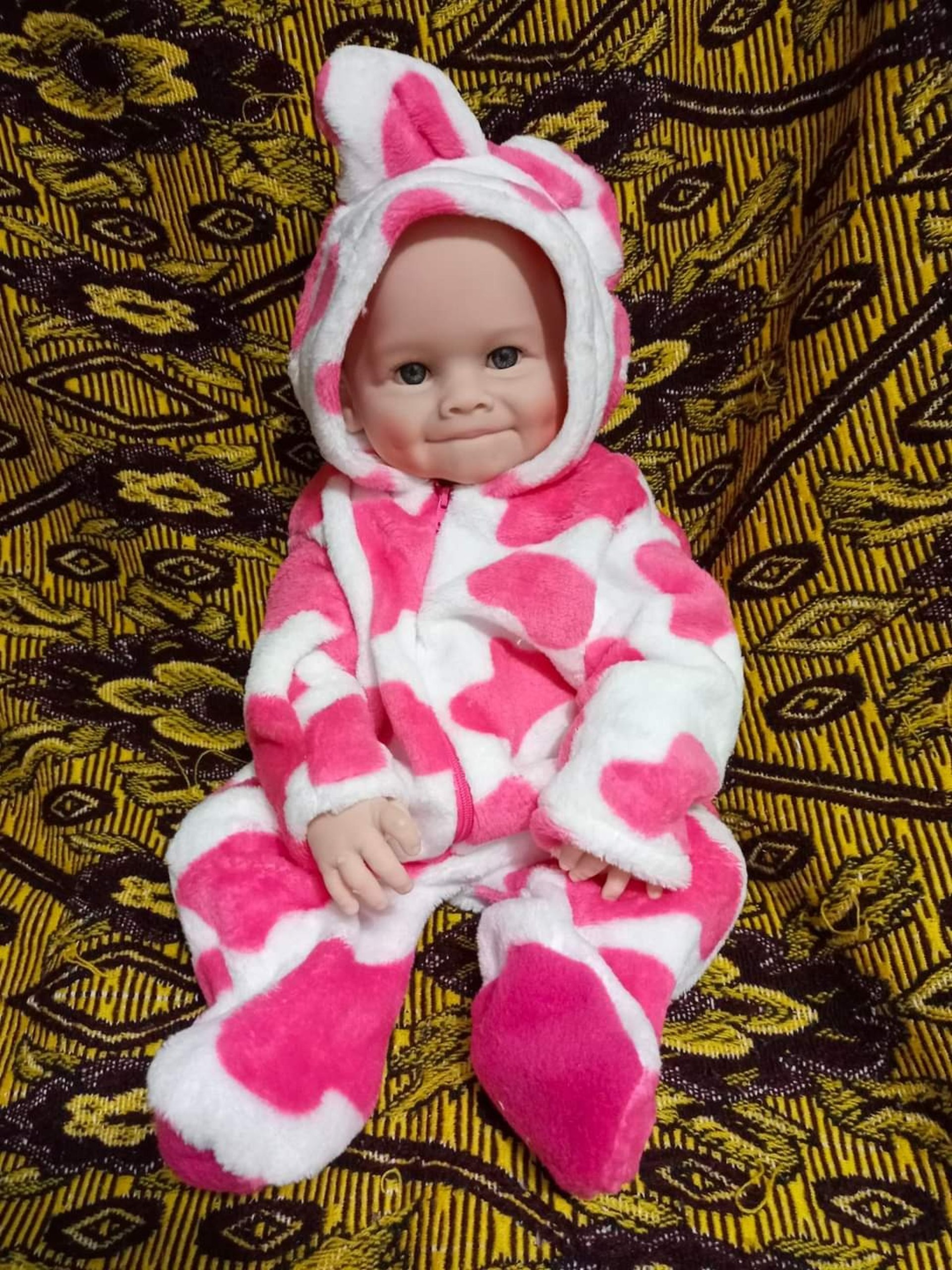 woman wearing yellow long-sleeved dress under white clouds and blue sky during daytime