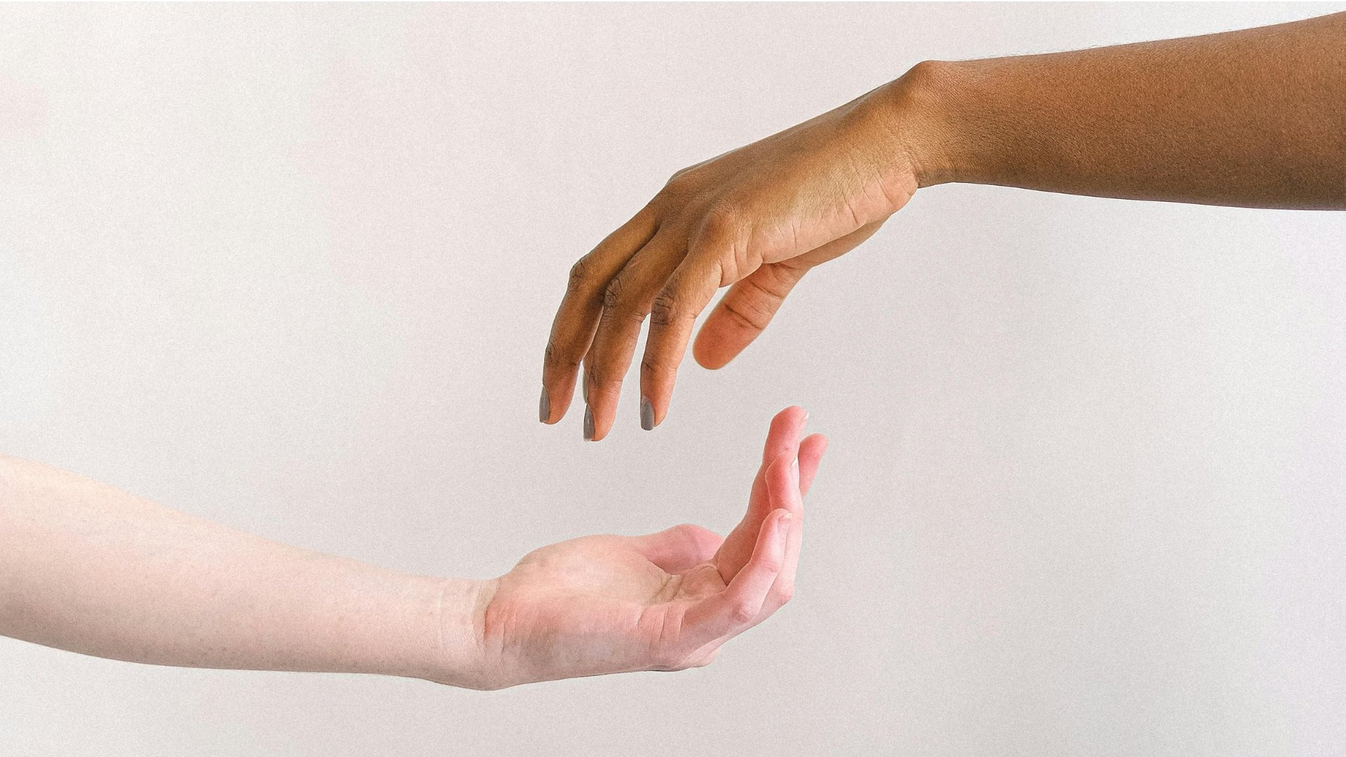 an abstract photo of a curved building with a blue sky in the background