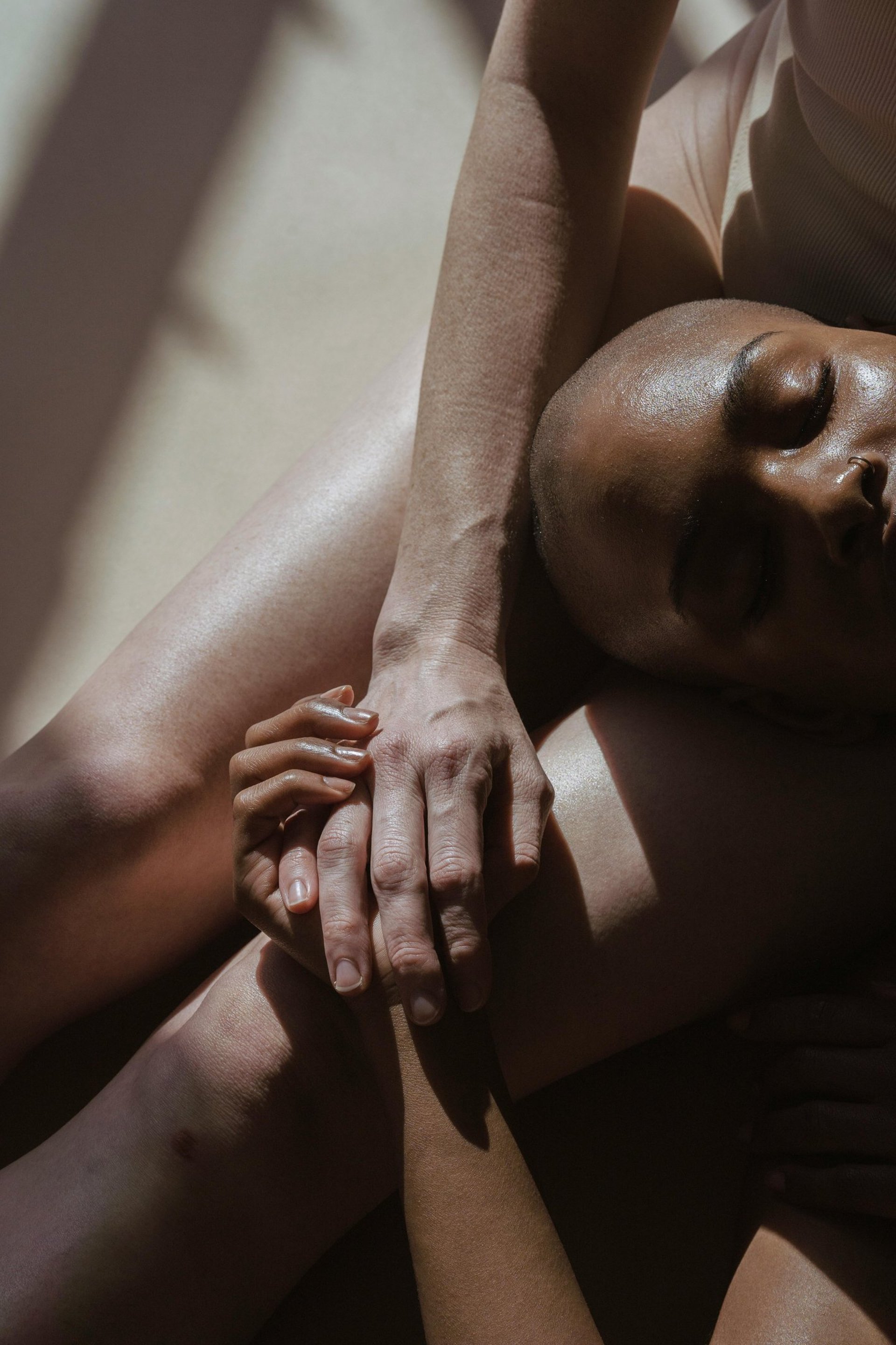 an abstract photo of a curved building with a blue sky in the background