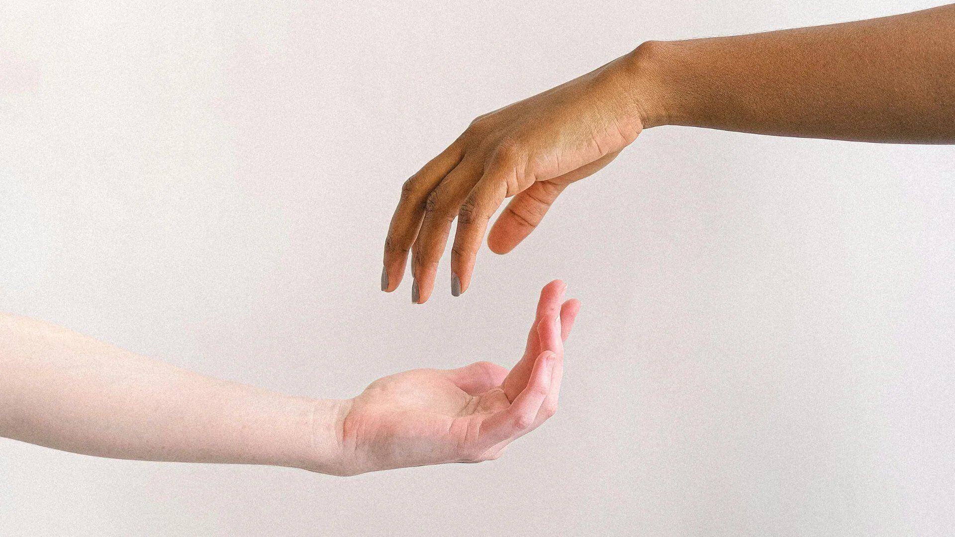 an abstract photo of a curved building with a blue sky in the background