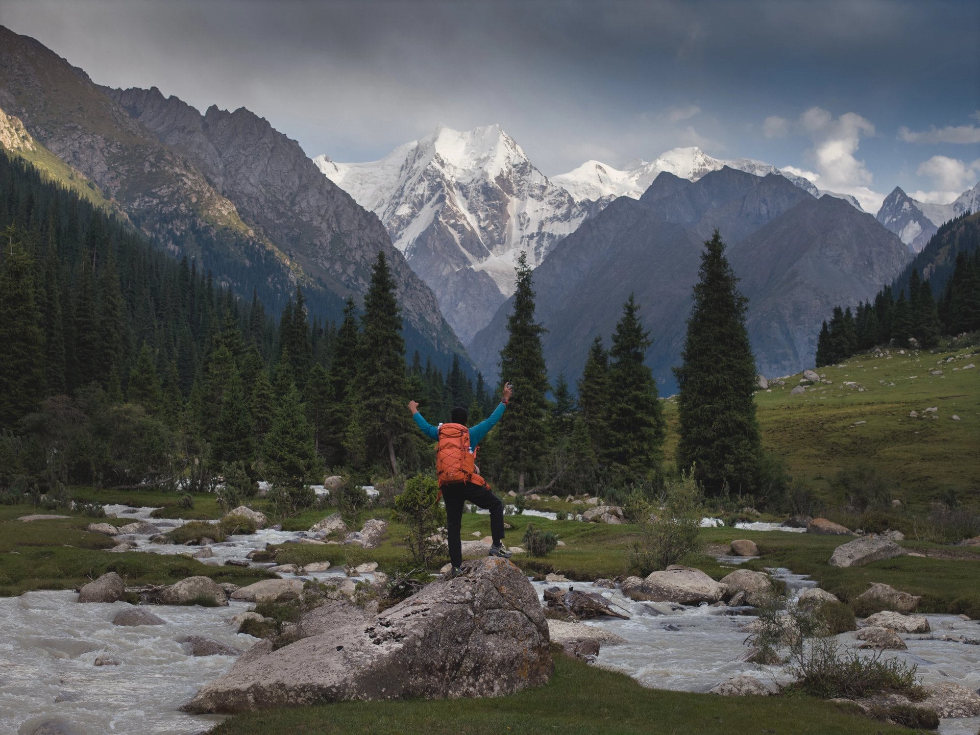 woman wearing yellow long-sleeved dress under white clouds and blue sky during daytime