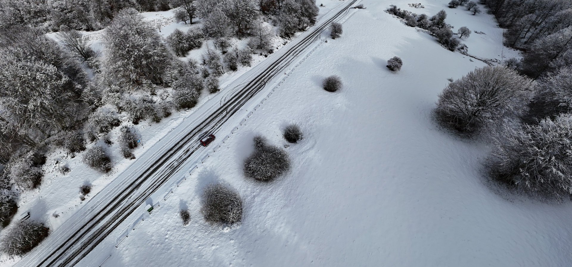 an abstract photo of a curved building with a blue sky in the background