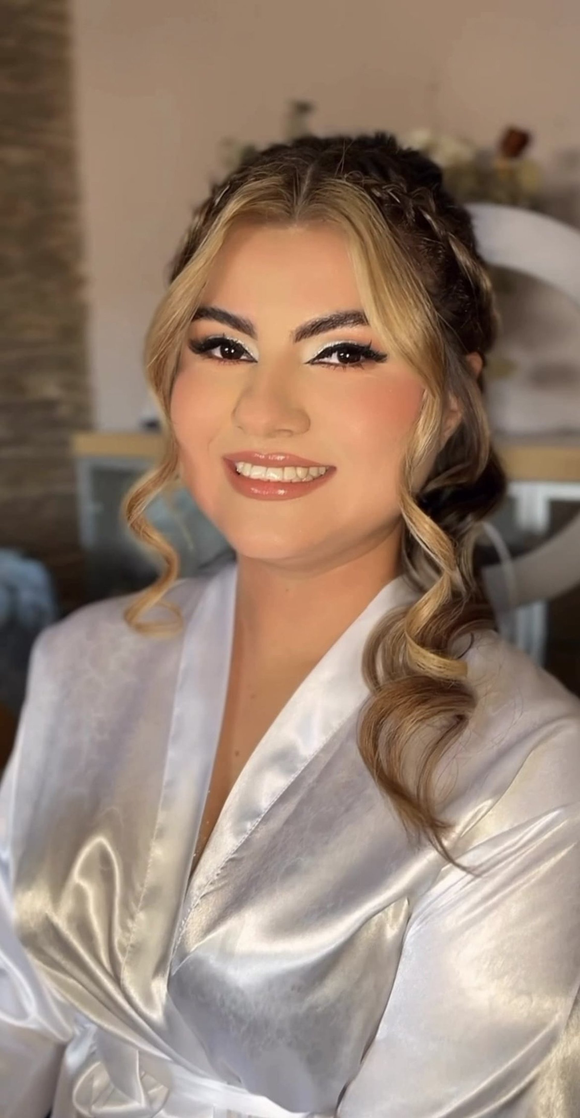 bouquet of assorted-color flowers hanged on brown plank with white textile