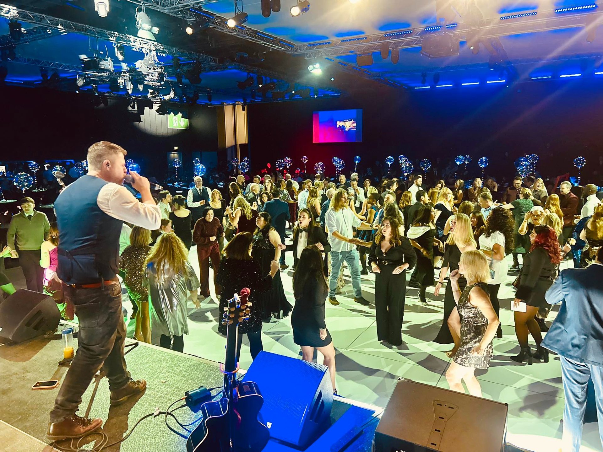 an abstract photo of a curved building with a blue sky in the background