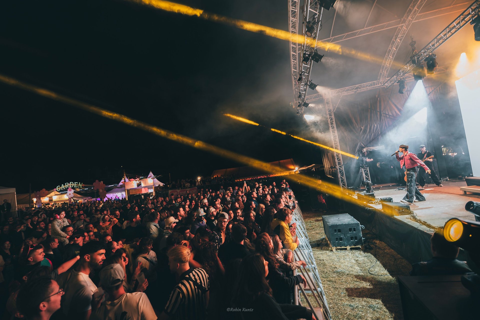 an abstract photo of a curved building with a blue sky in the background