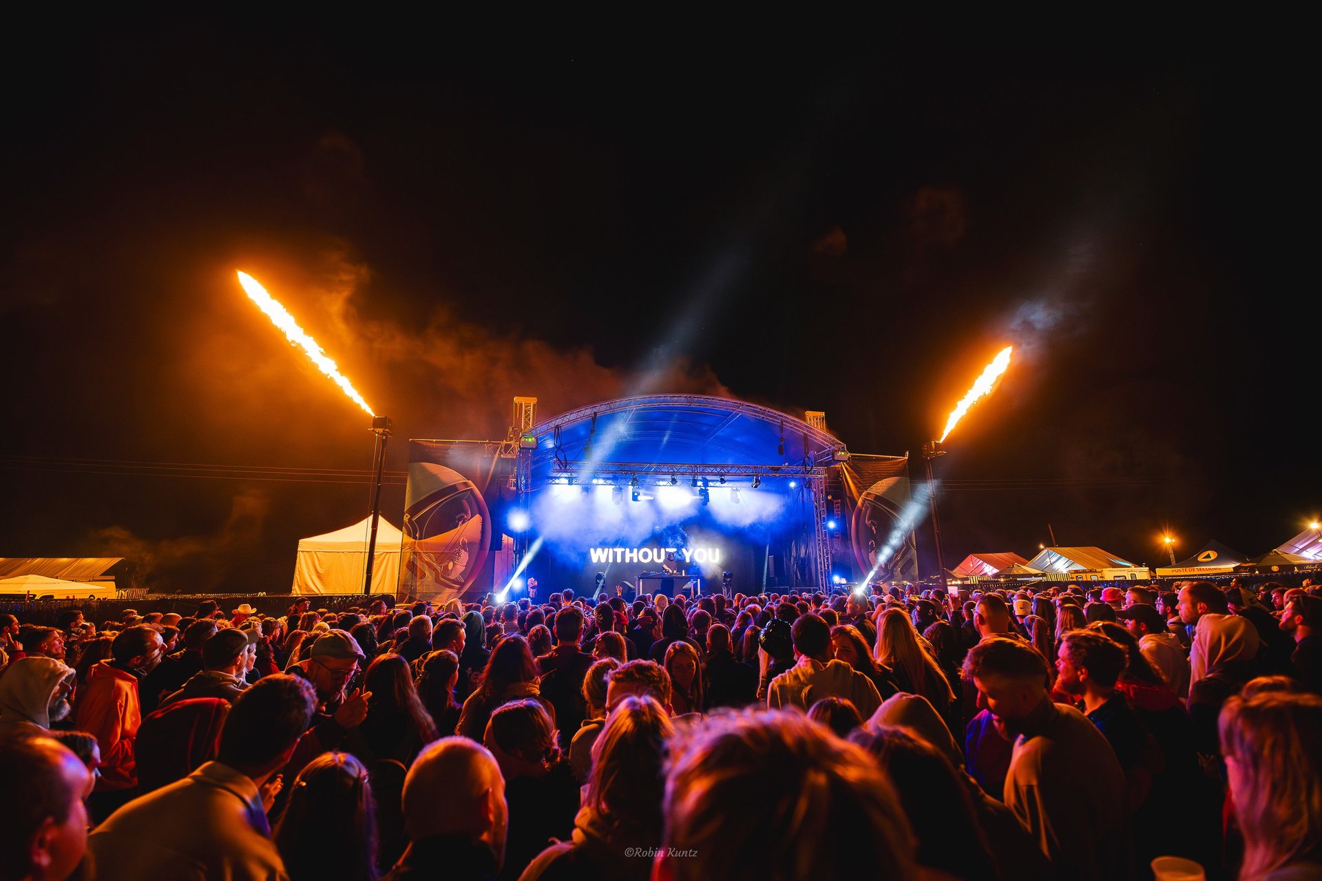 an abstract photo of a curved building with a blue sky in the background
