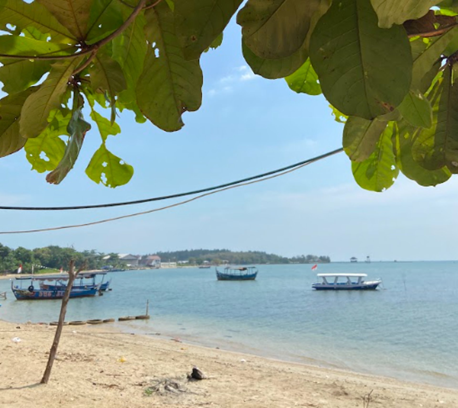 an abstract photo of a curved building with a blue sky in the background