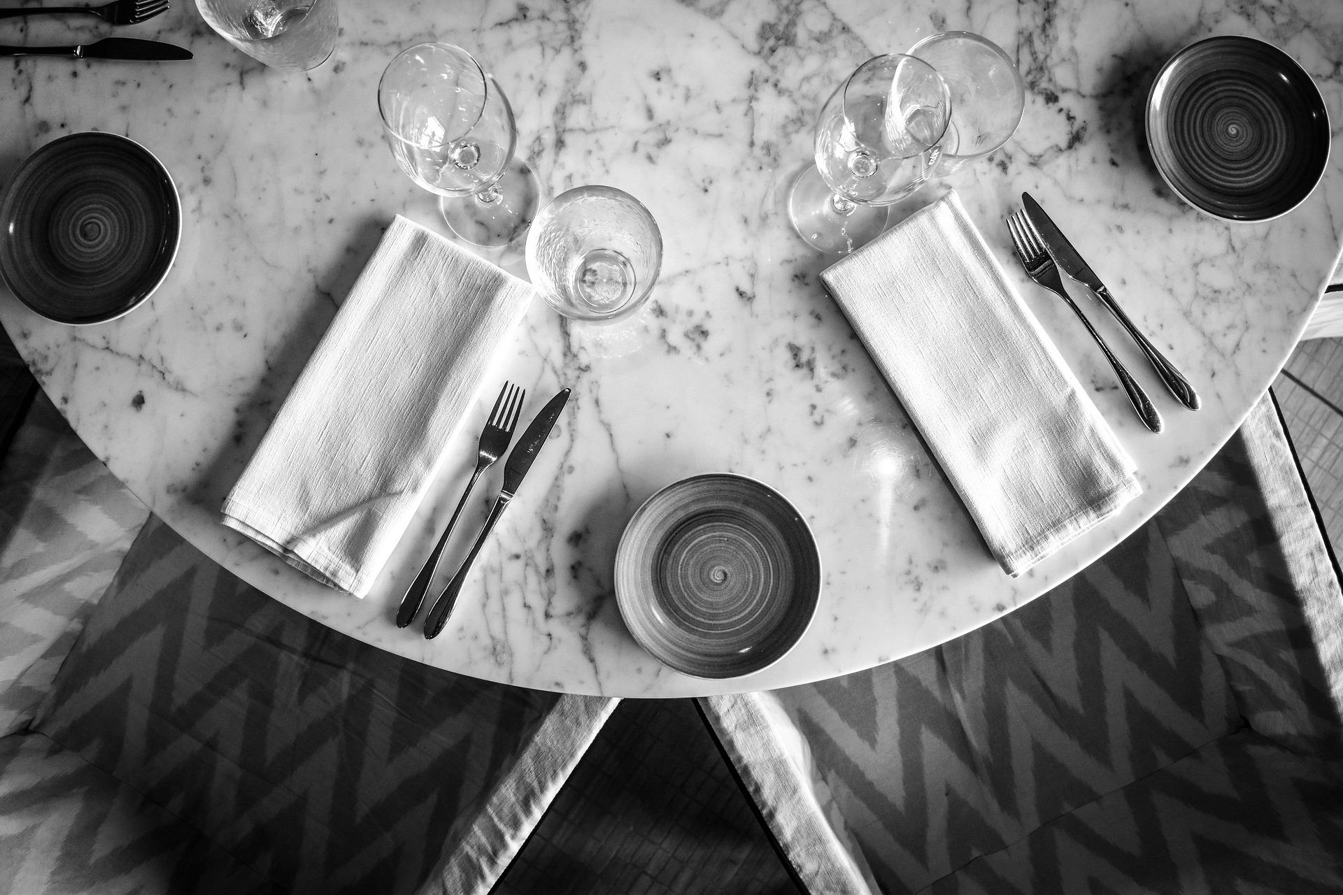 a long table is set with candles and place settings