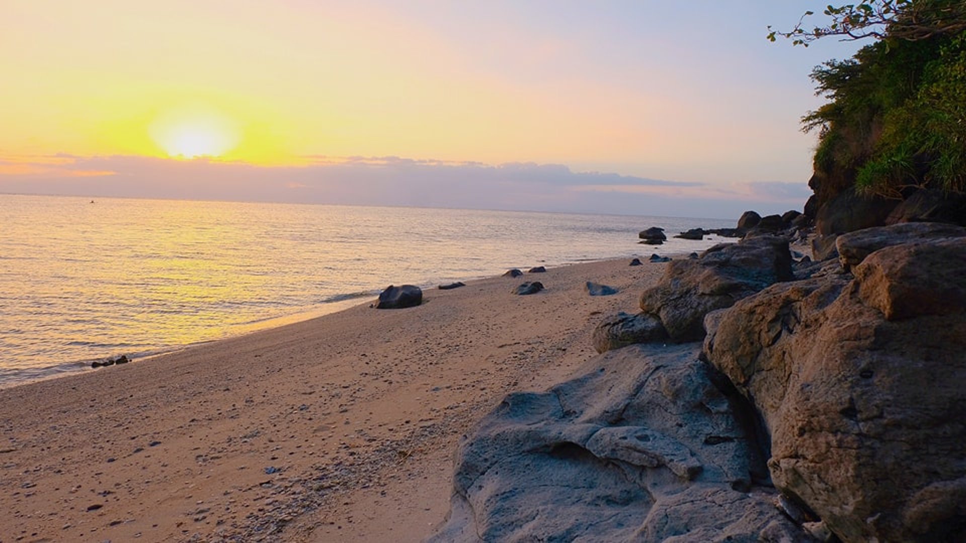 an abstract photo of a curved building with a blue sky in the background
