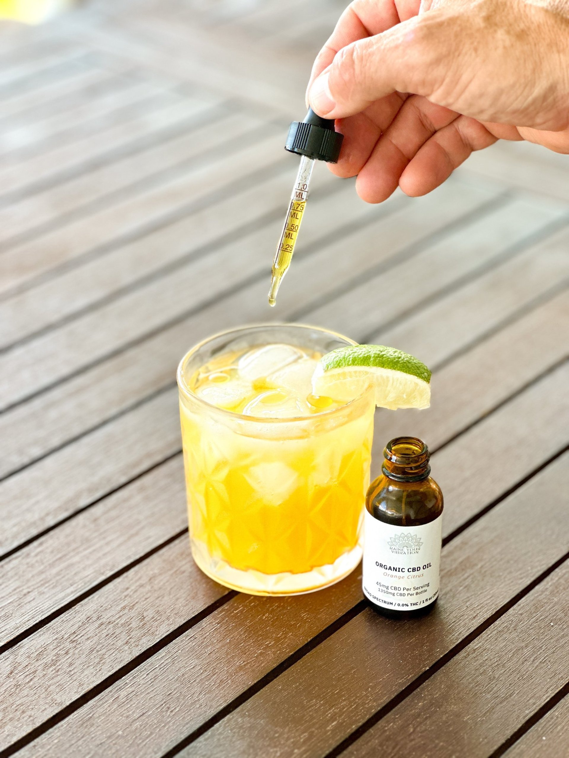 Row of champagne glasses with pink drinks.