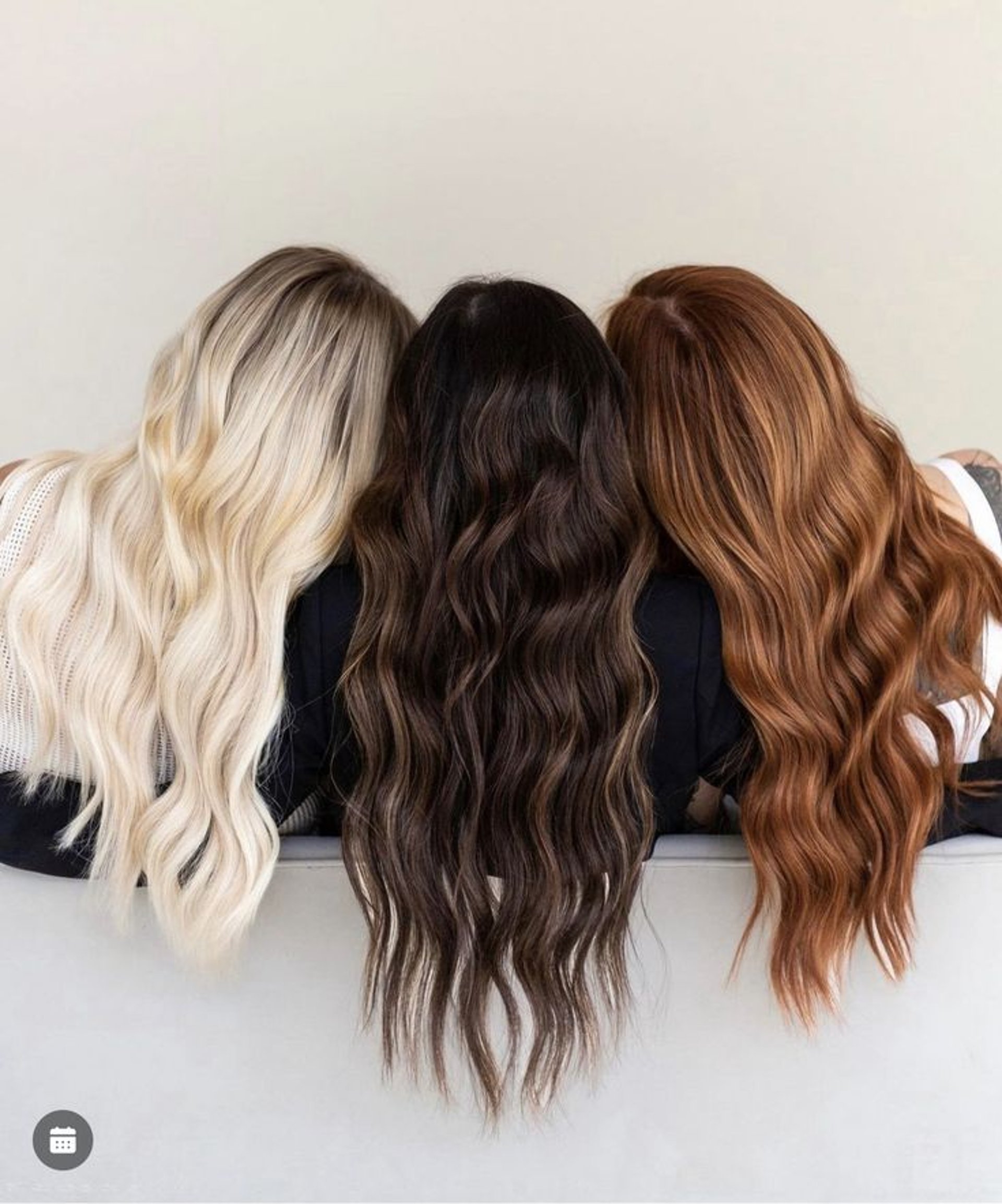 blonde haired woman in black top surrounded by tall plants
