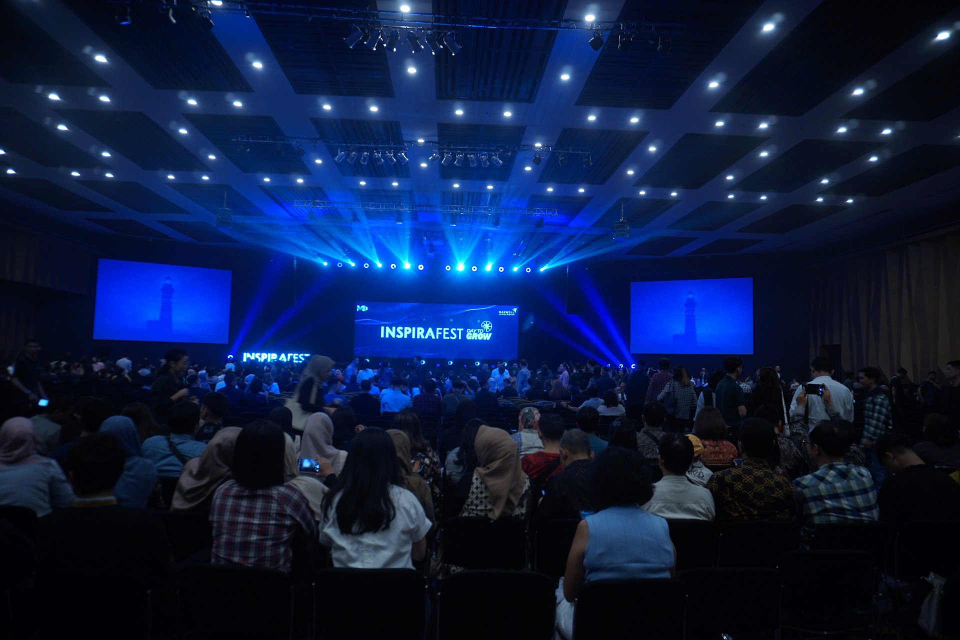 an abstract photo of a curved building with a blue sky in the background