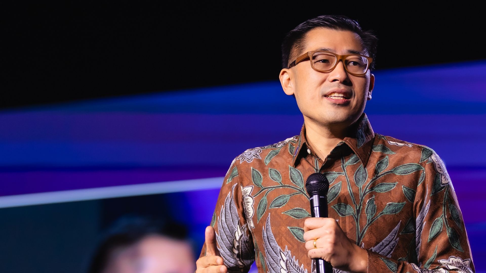 an abstract photo of a curved building with a blue sky in the background