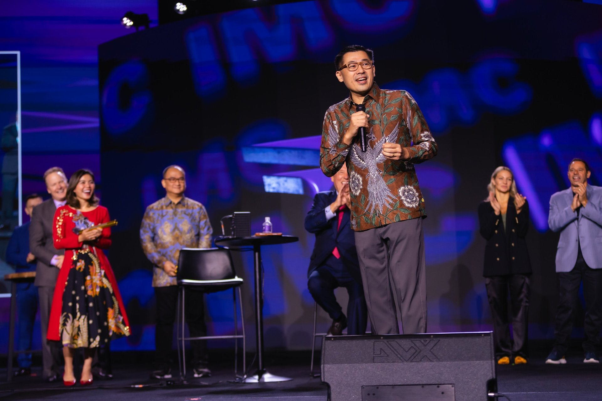 an abstract photo of a curved building with a blue sky in the background