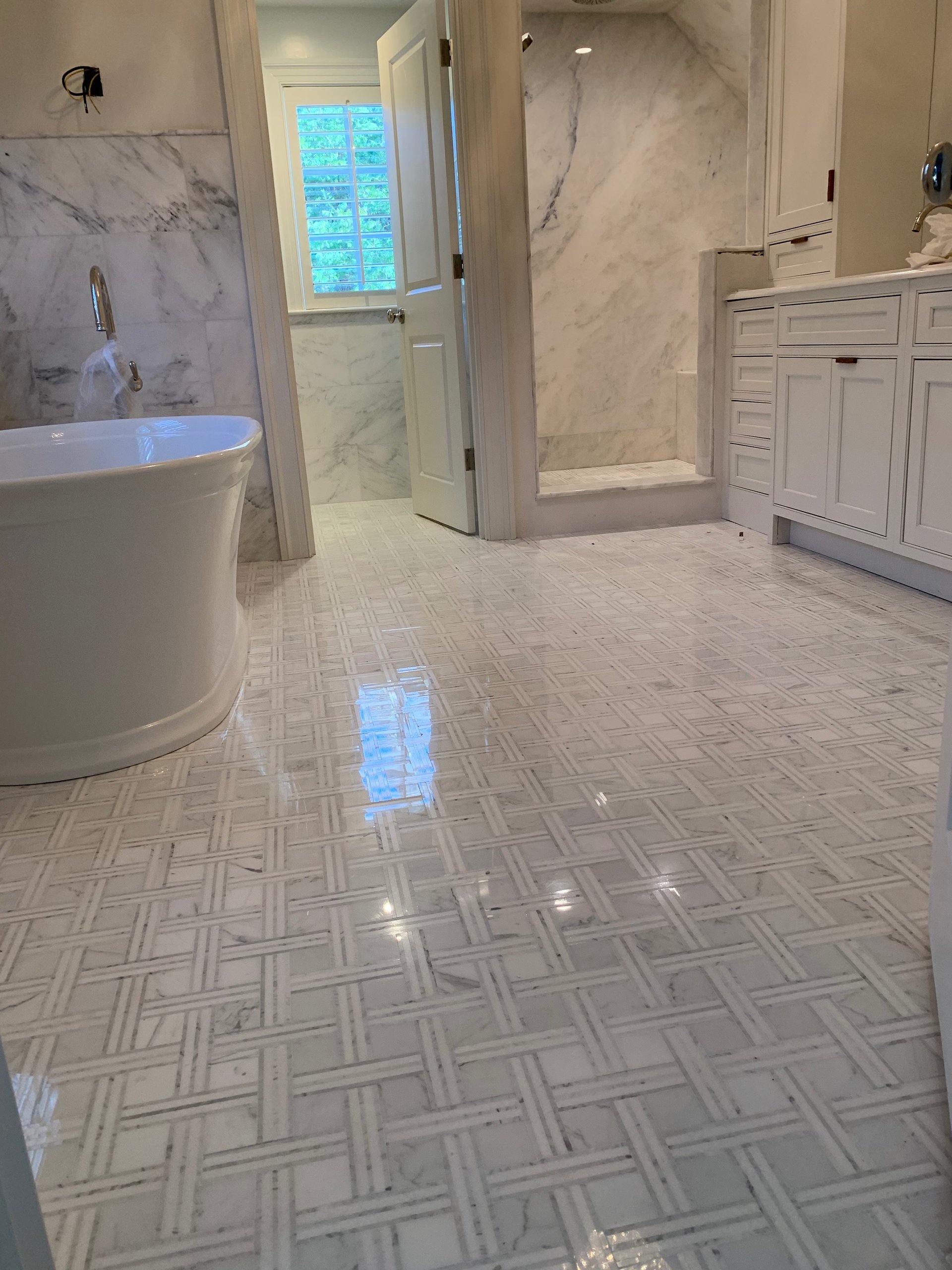 an abstract photo of a curved building with a blue sky in the background