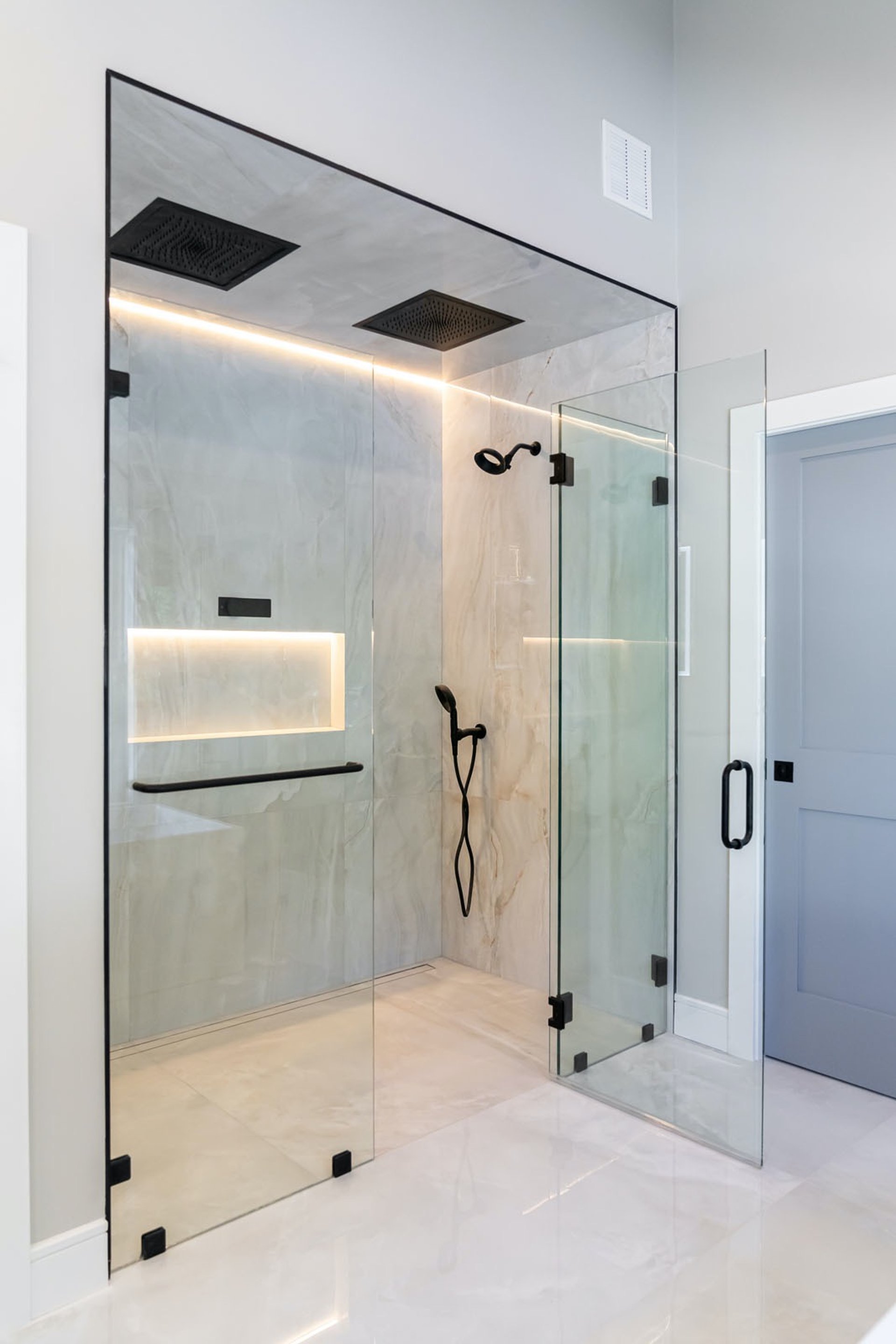 an abstract photo of a curved building with a blue sky in the background