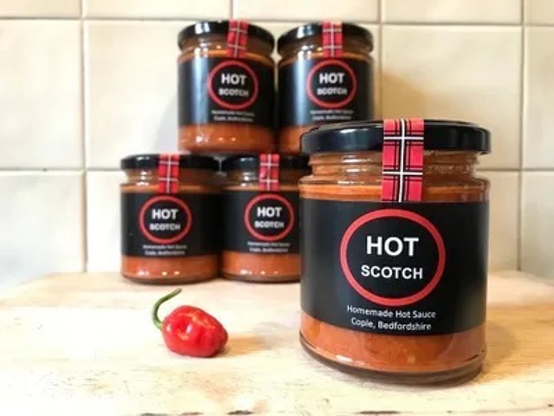 person wearing grey knit sweater