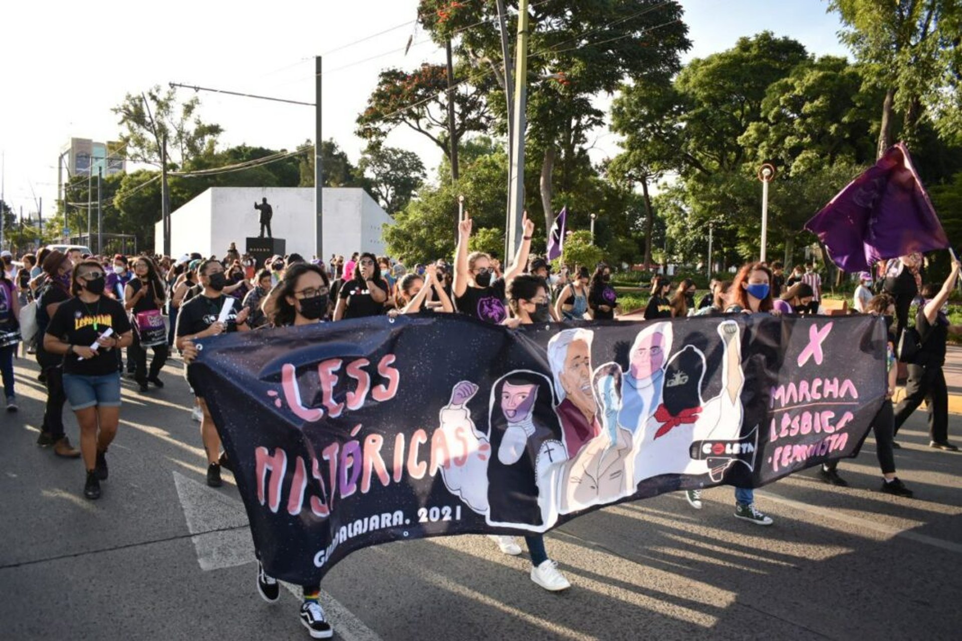 an abstract photo of a curved building with a blue sky in the background