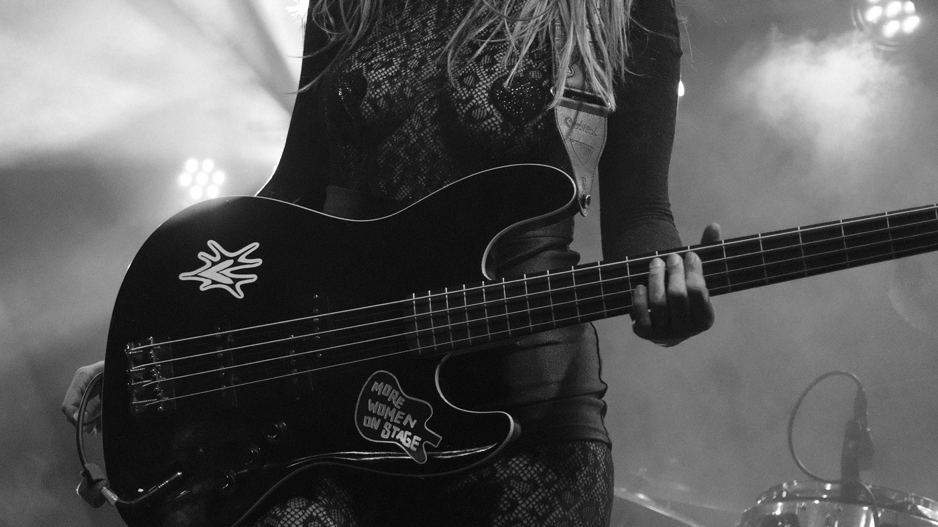 an abstract photo of a curved building with a blue sky in the background