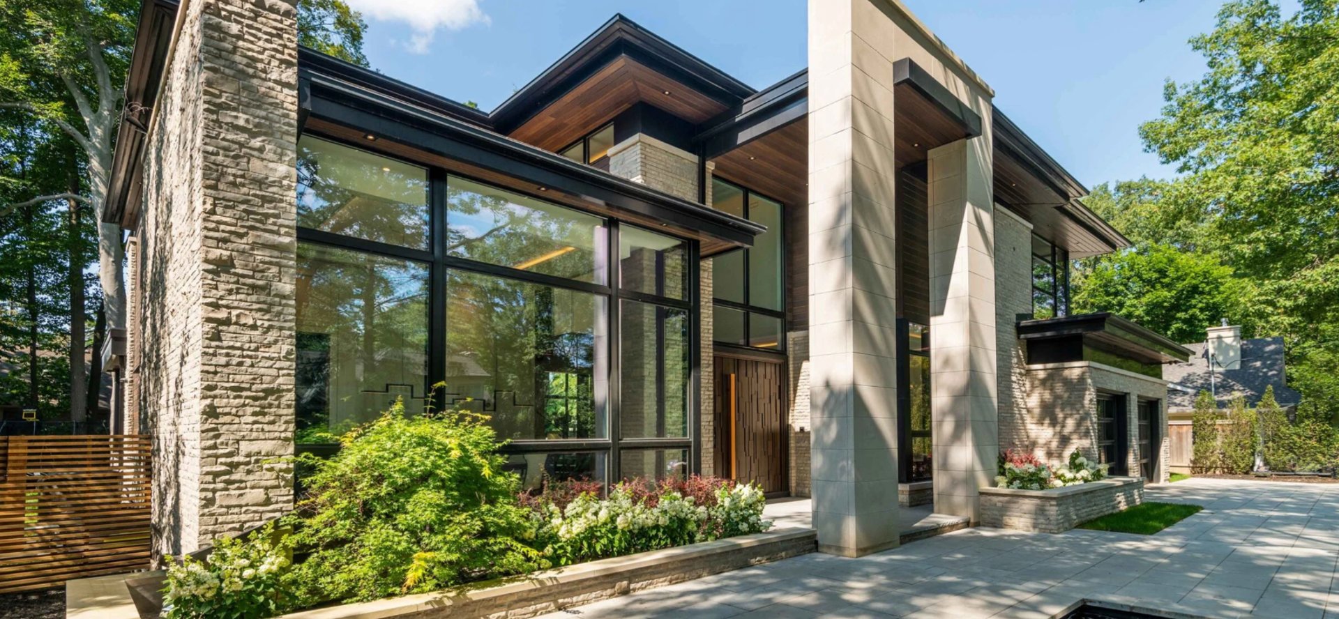 green wooden window surrounded with green leaves