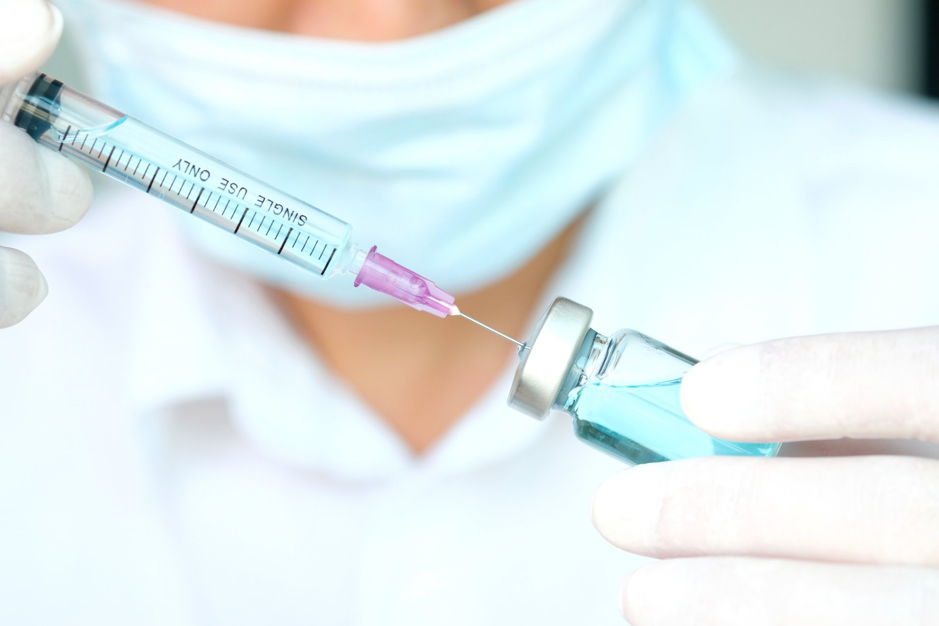 red apple fruit beside clear plastic bottle