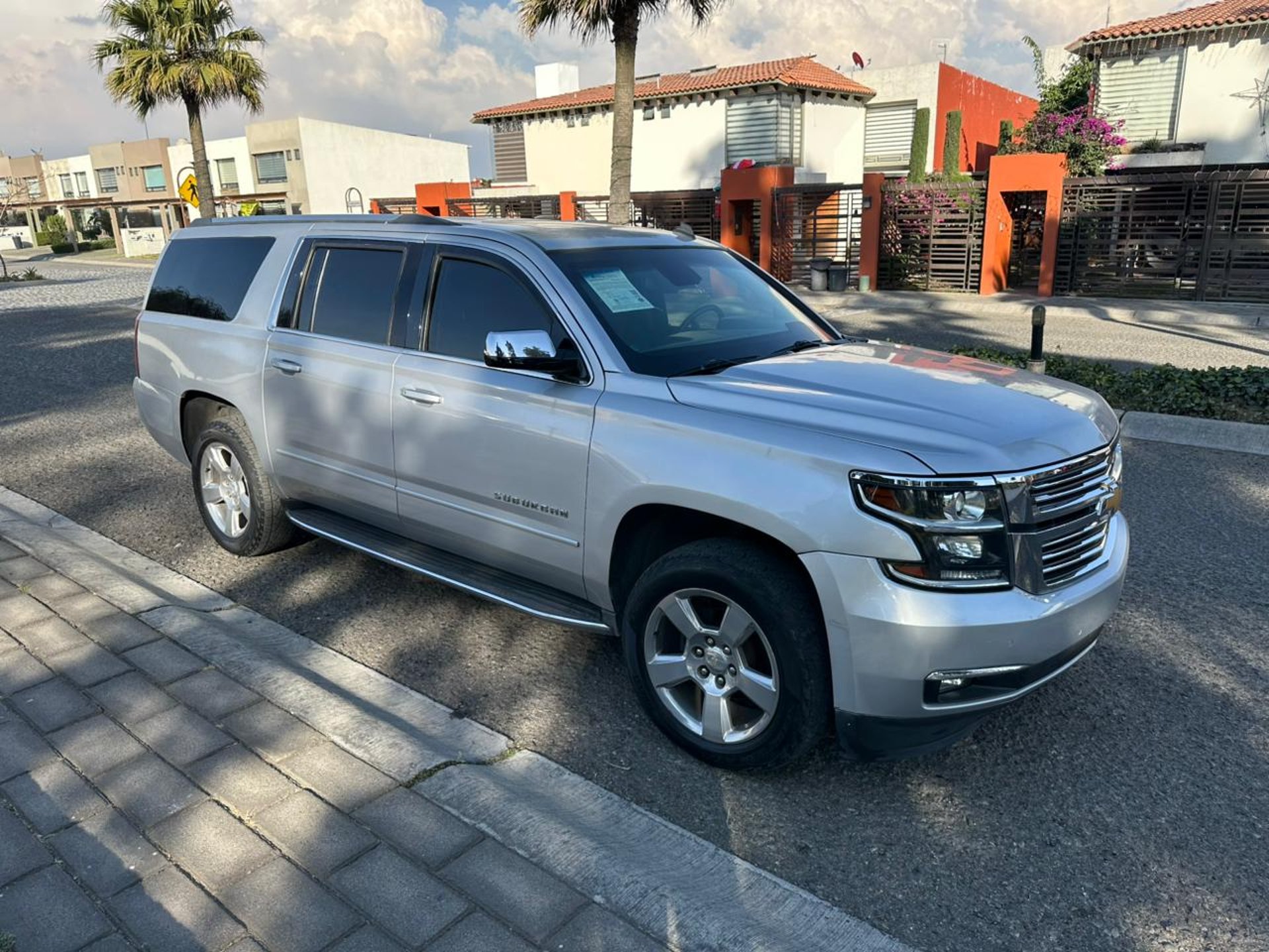 woman wearing yellow long-sleeved dress under white clouds and blue sky during daytime