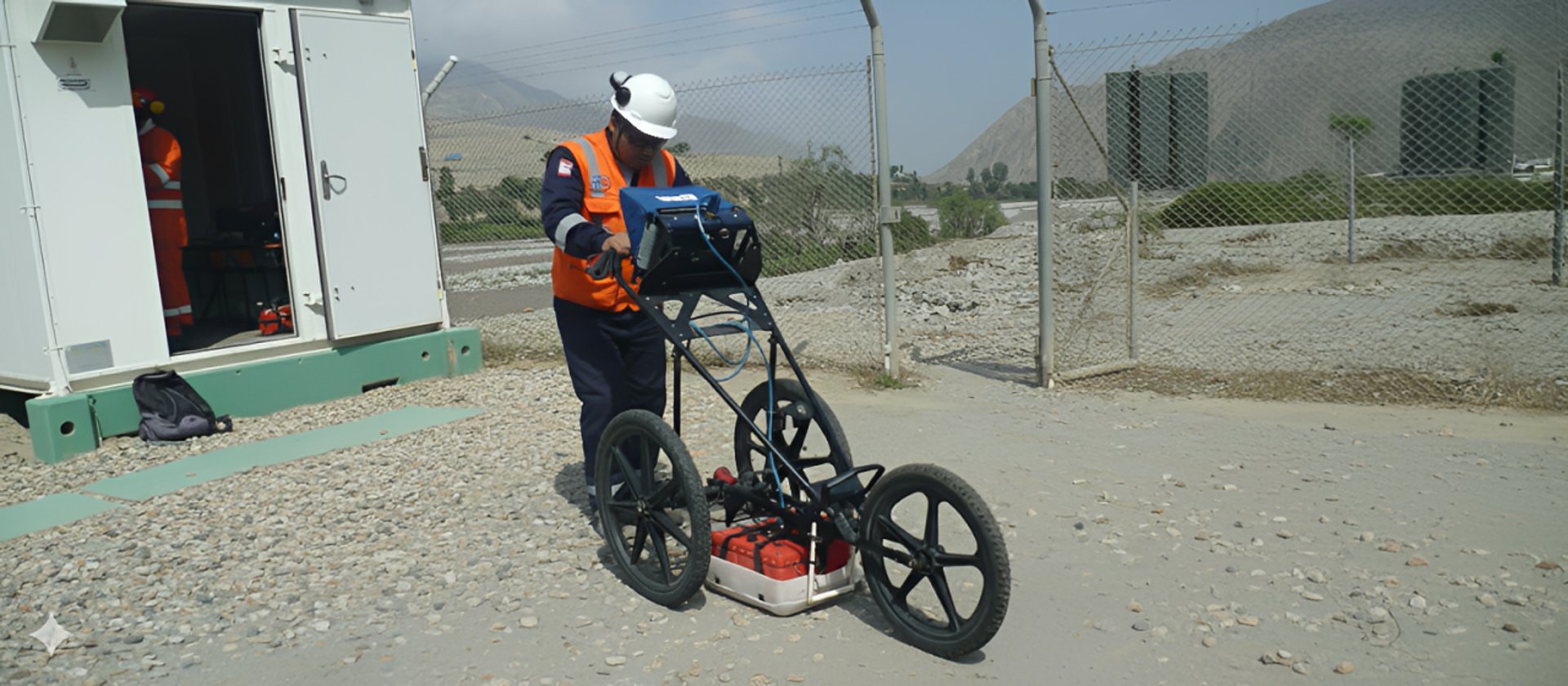 gray tripod on brown rock