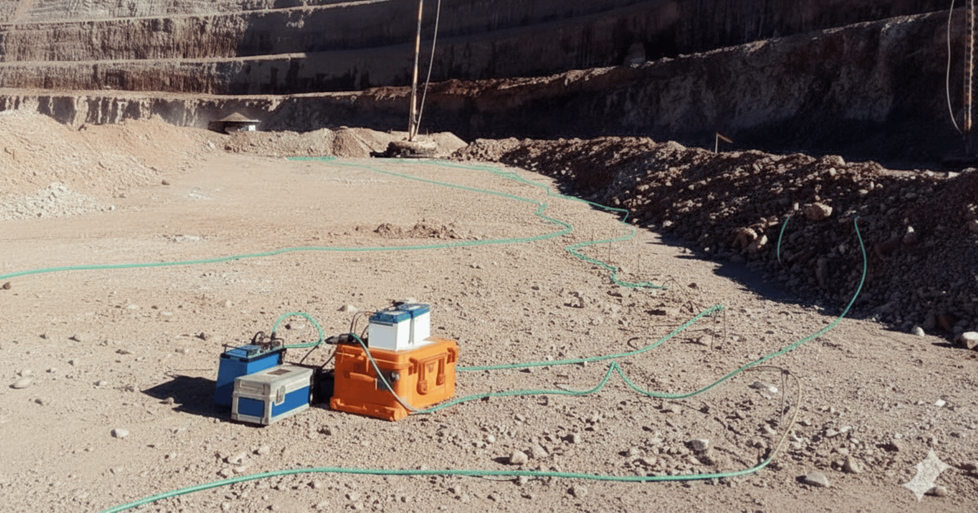 a man standing next to a yellow and black tripod
