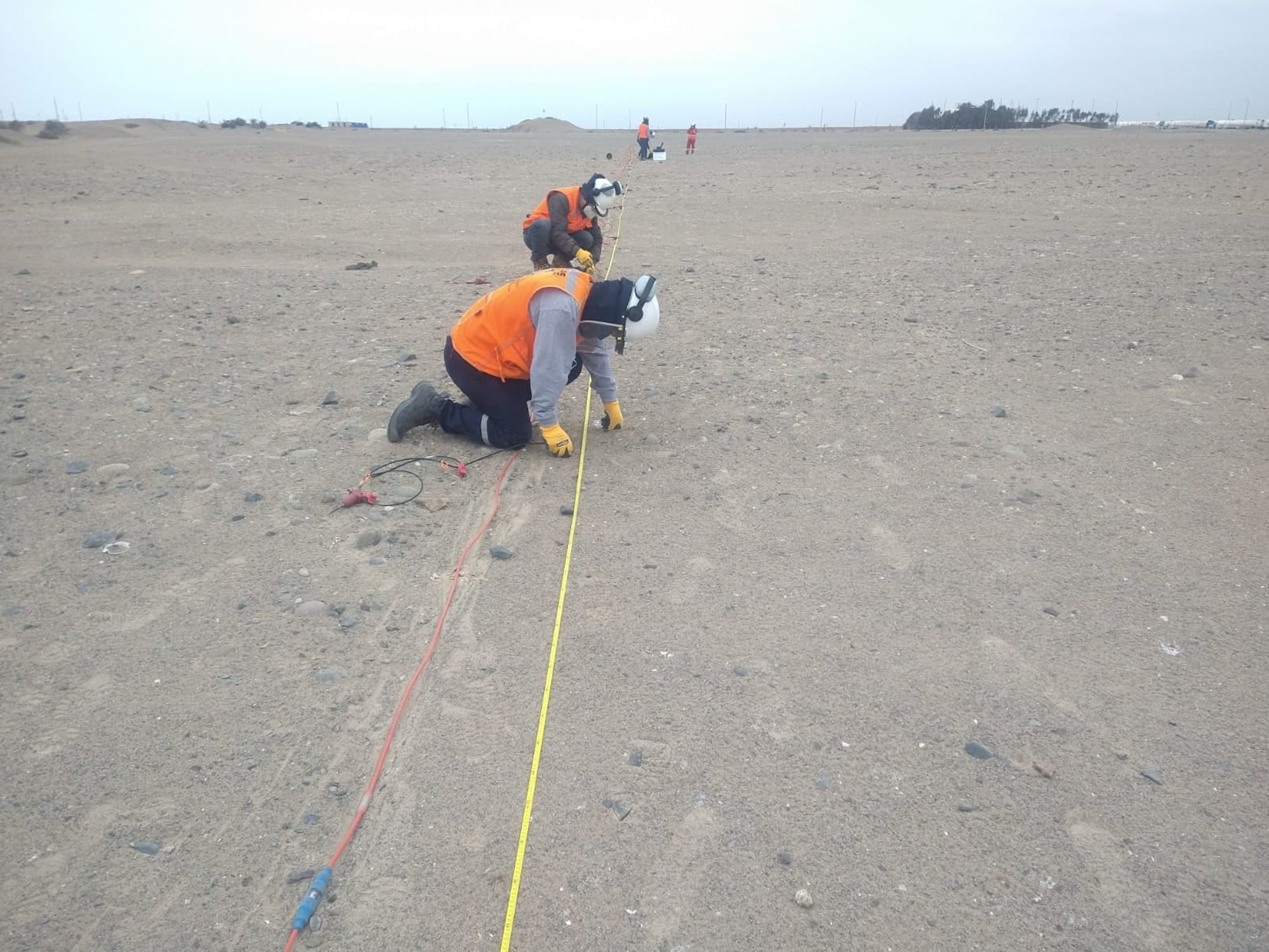 gray tripod on brown rock
