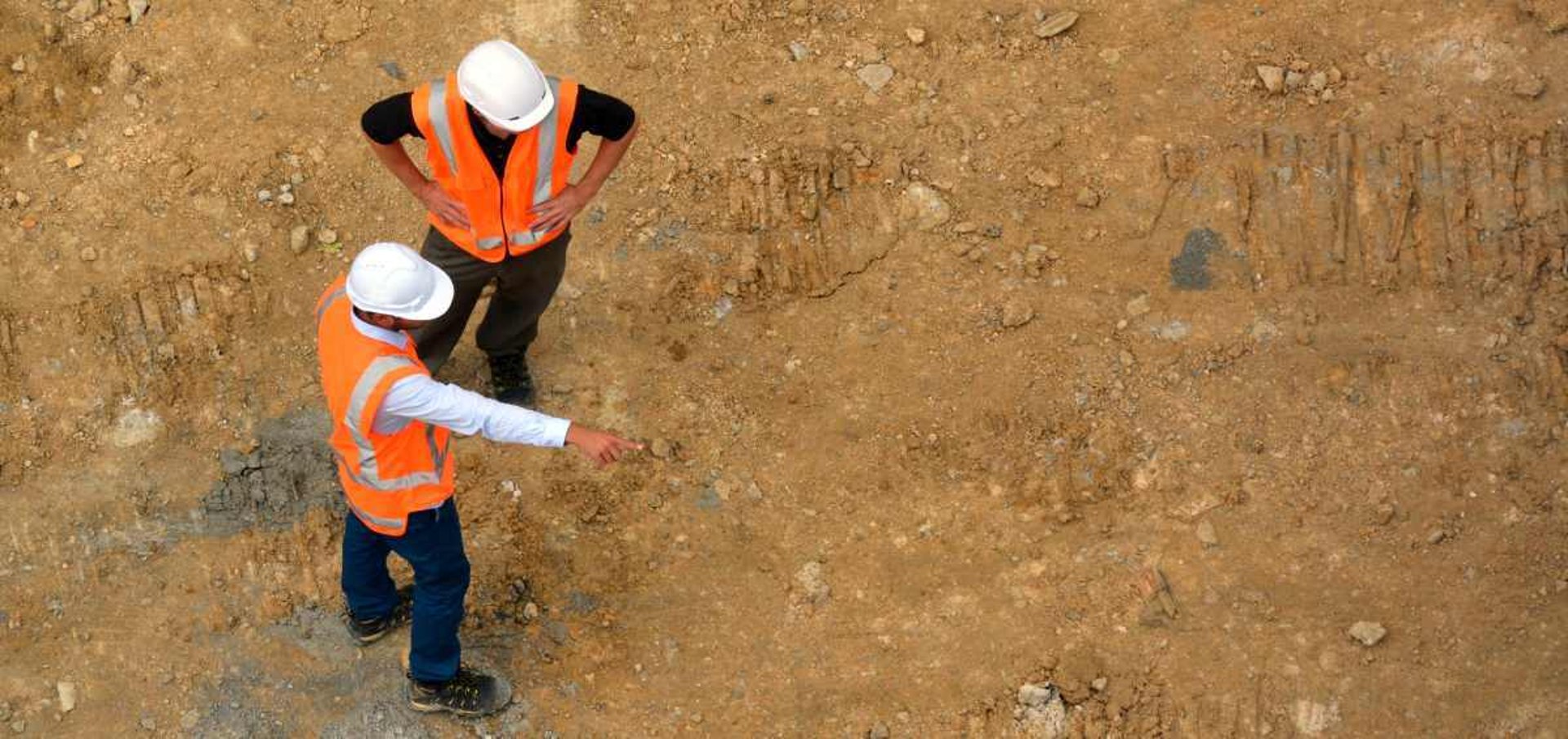 gray tripod on brown rock