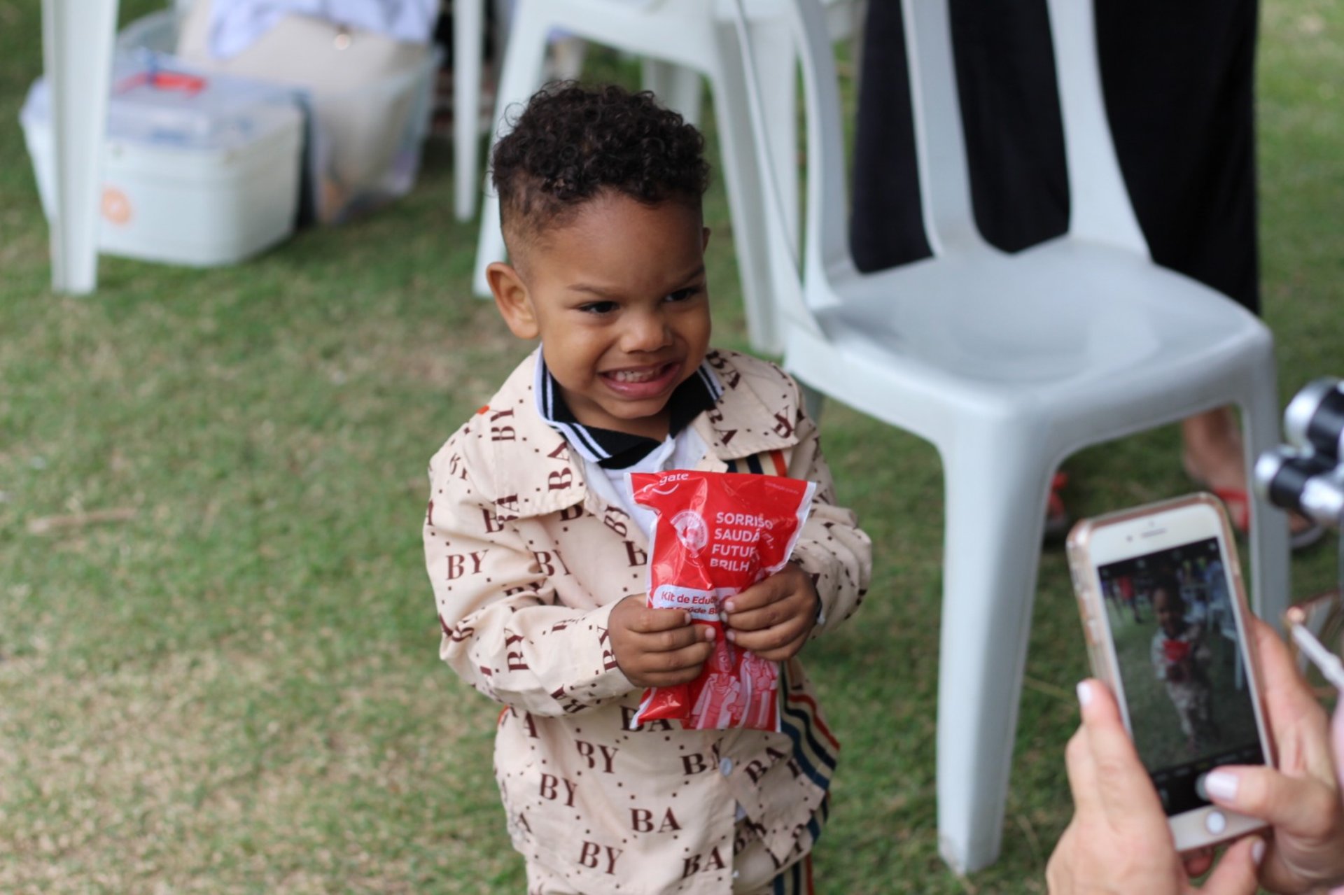 girl in blue tank top sitting on red textile