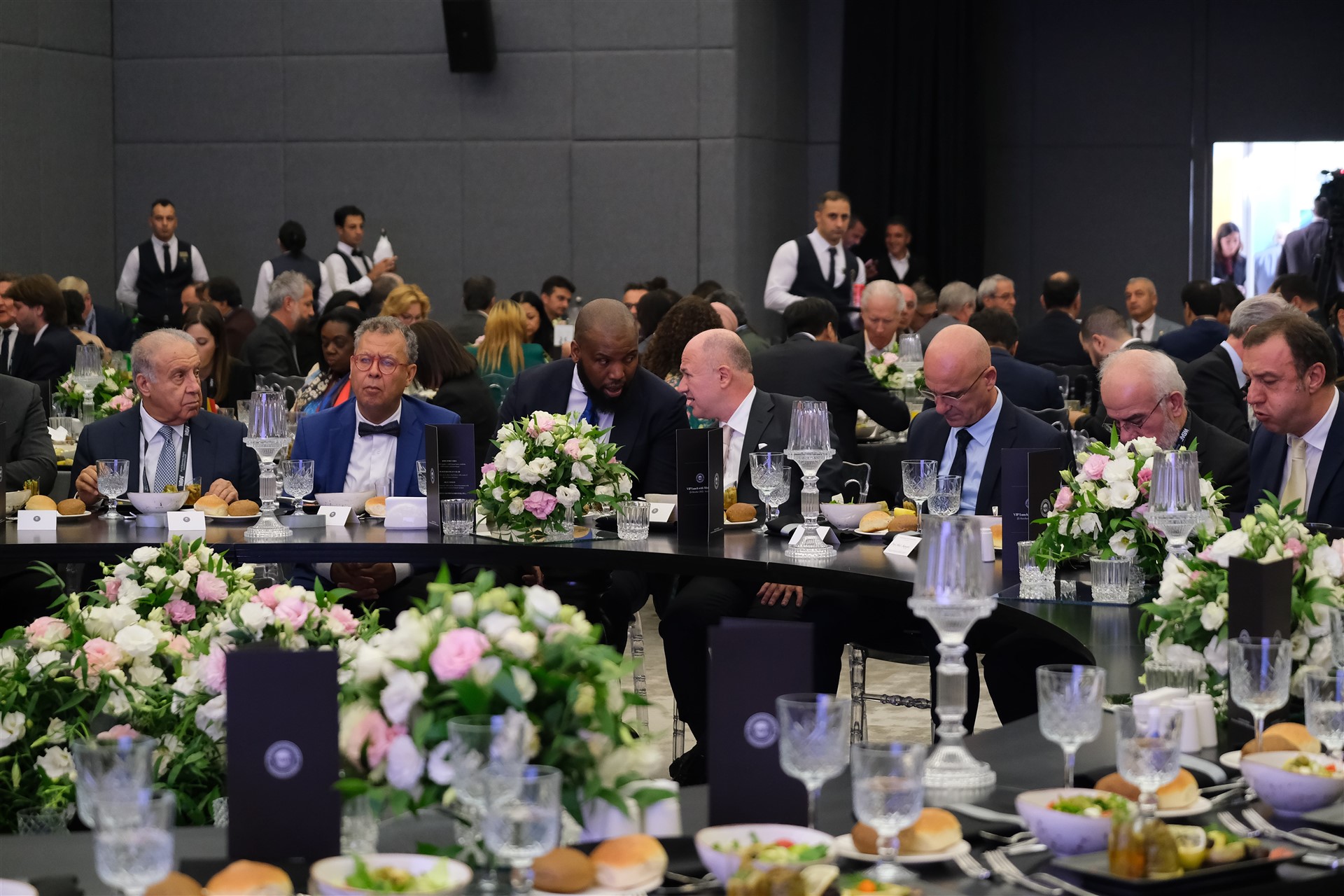 woman blowing assorted color confettis