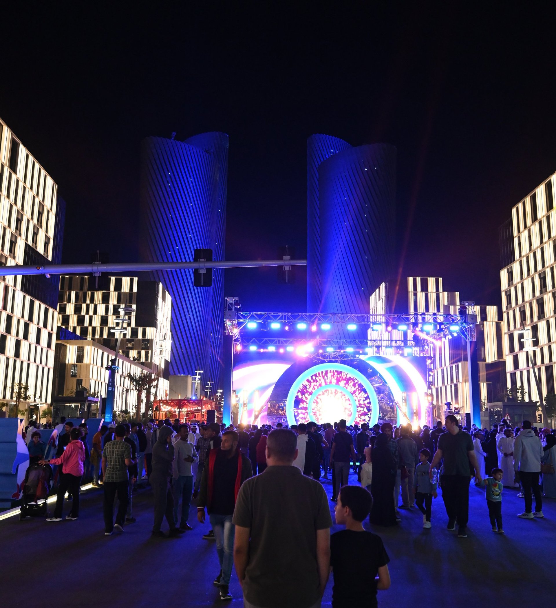 an abstract photo of a curved building with a blue sky in the background