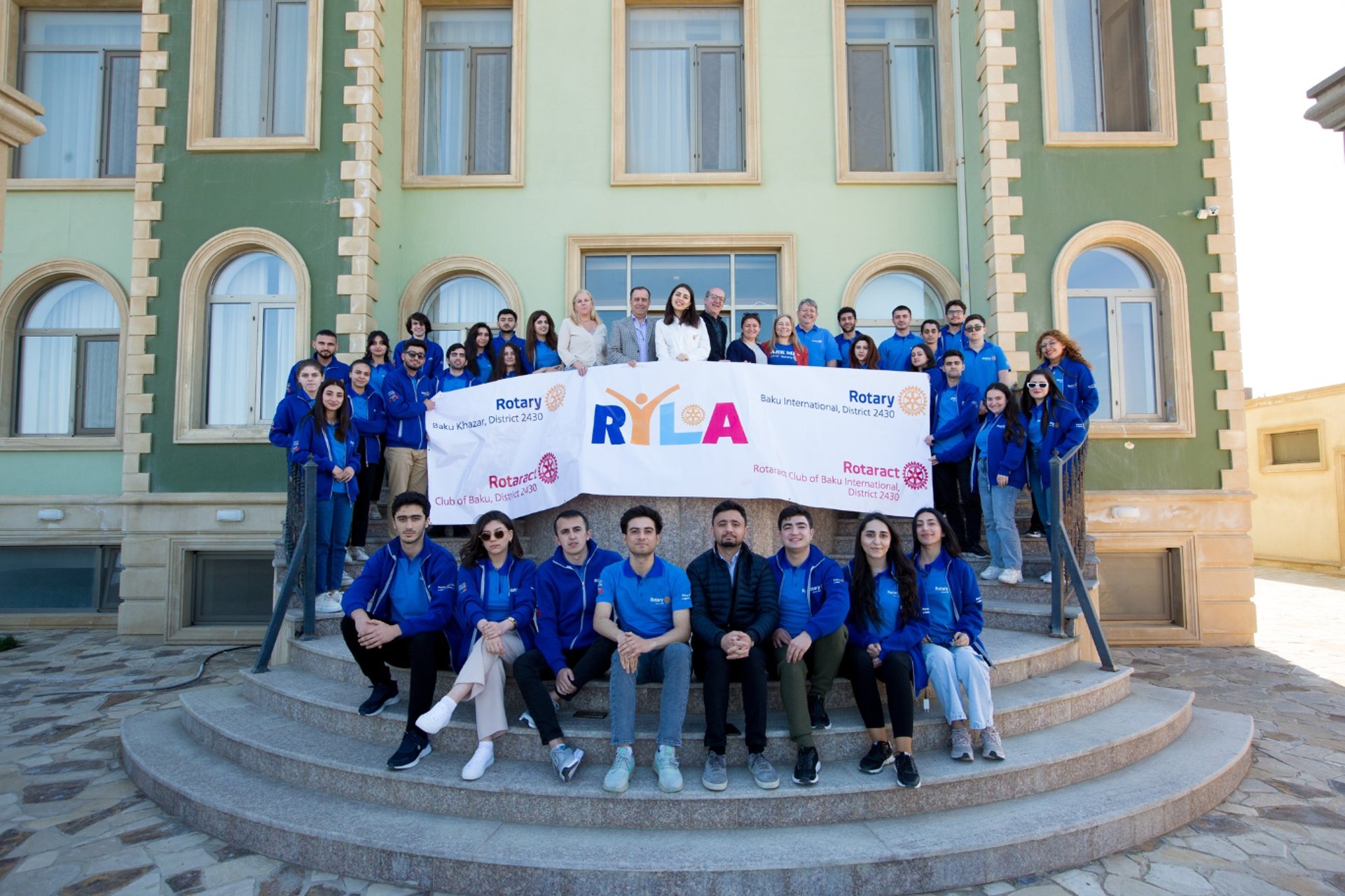 an abstract photo of a curved building with a blue sky in the background