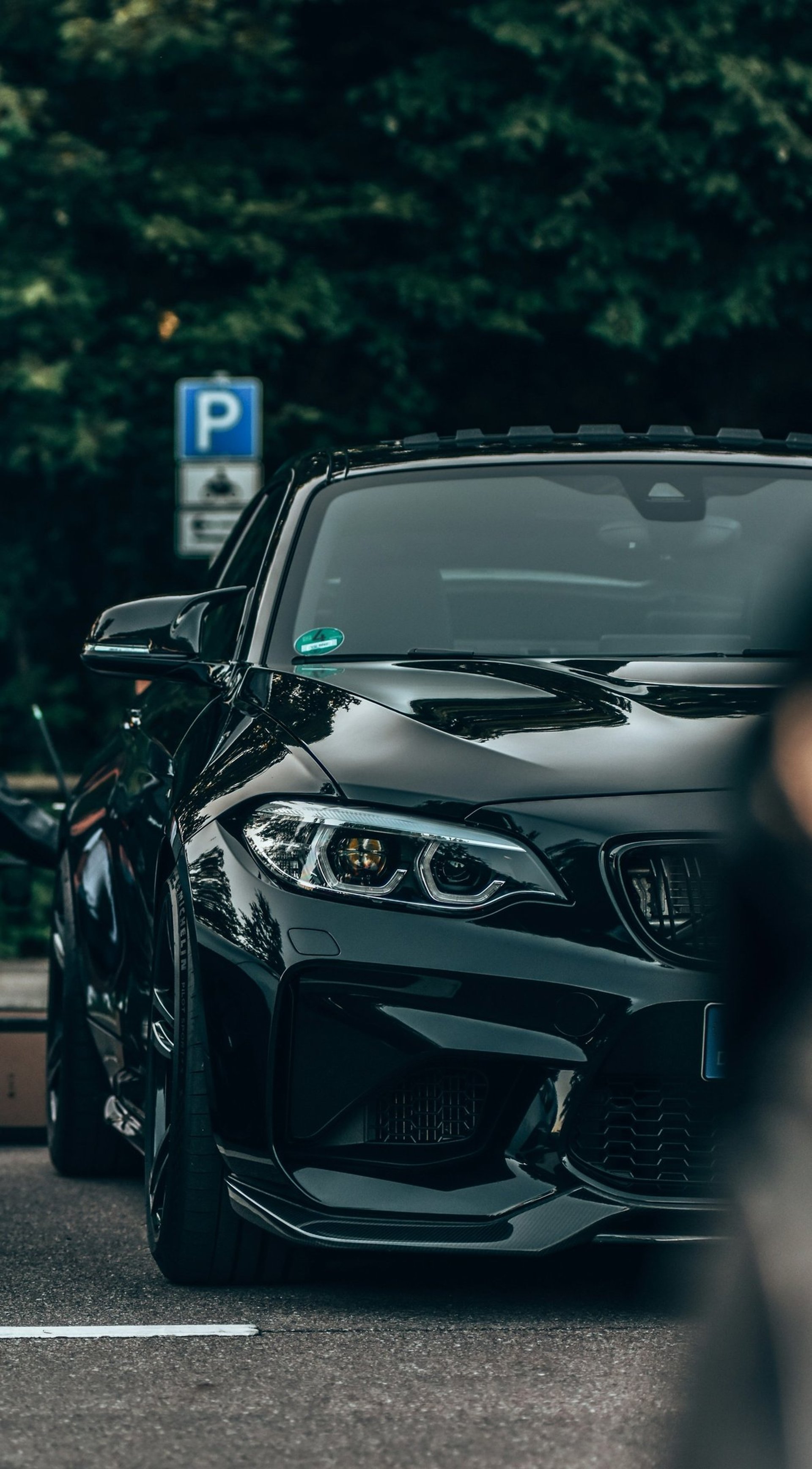 a car parked on the side of the road with its hood open
