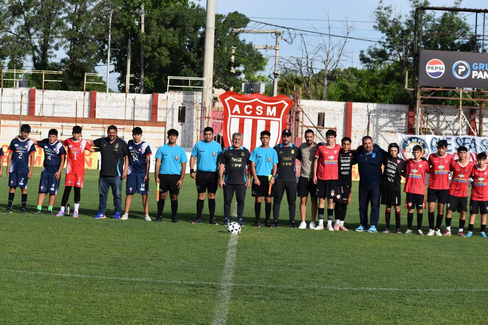 an abstract photo of a curved building with a blue sky in the background