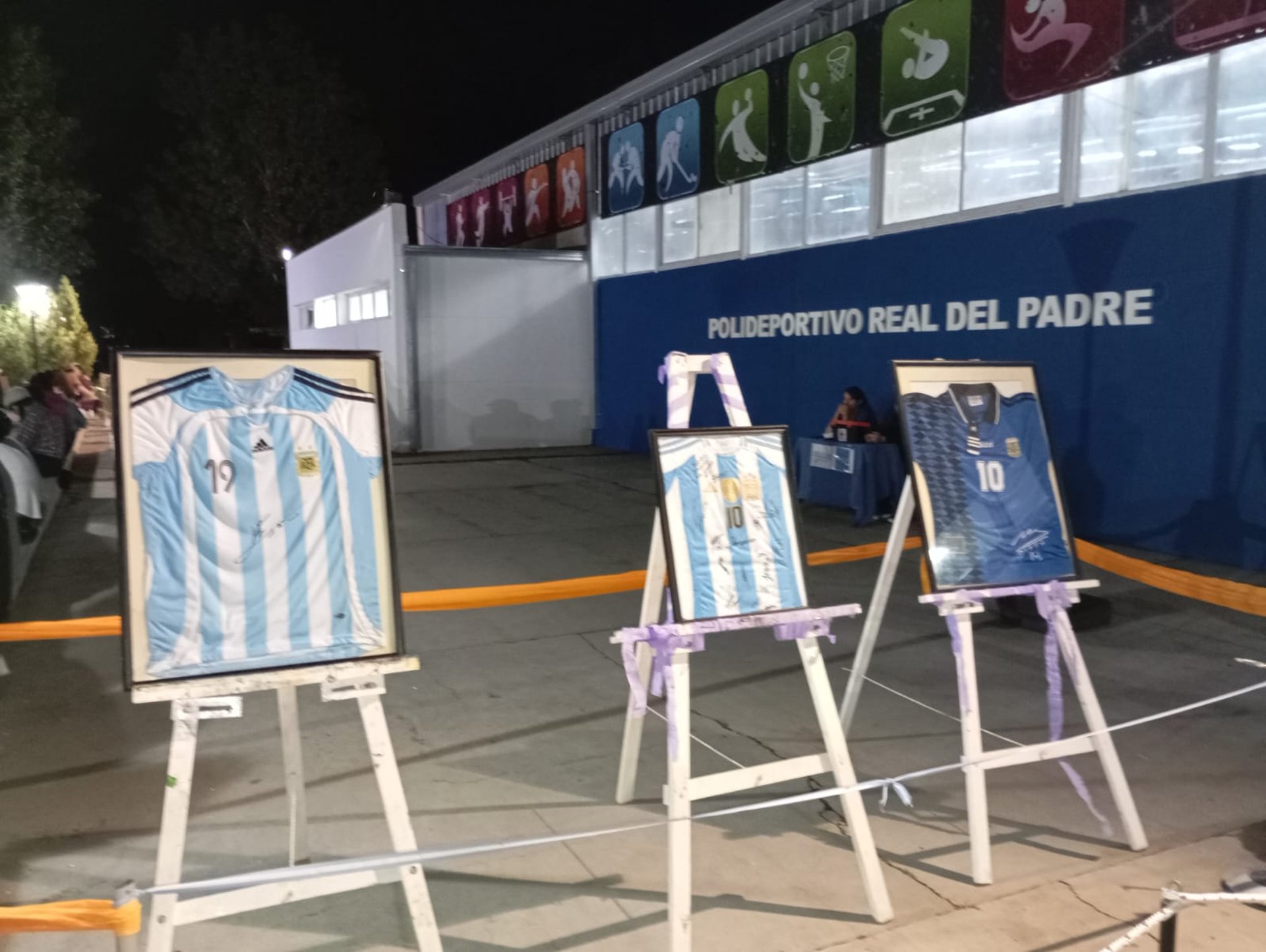 an abstract photo of a curved building with a blue sky in the background