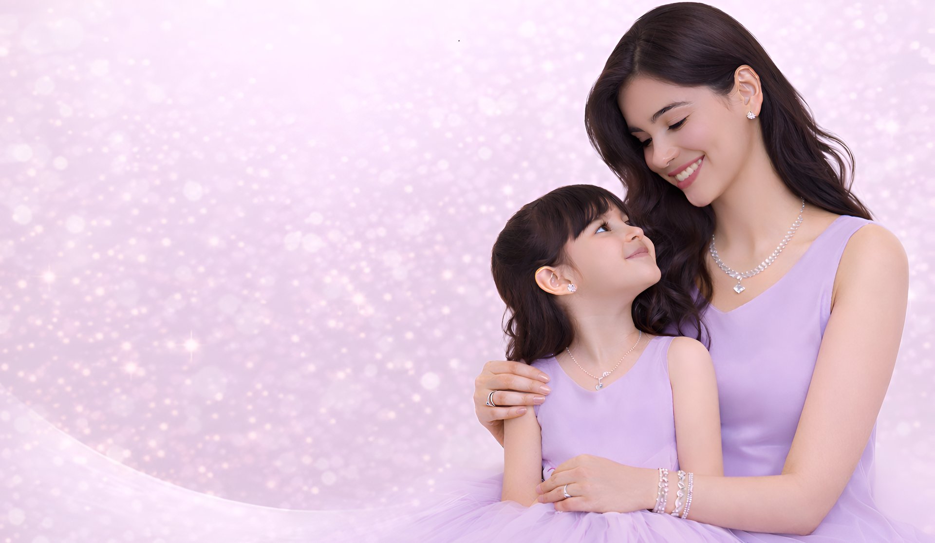 woman in pink blazer wearing silver heart pendant necklace