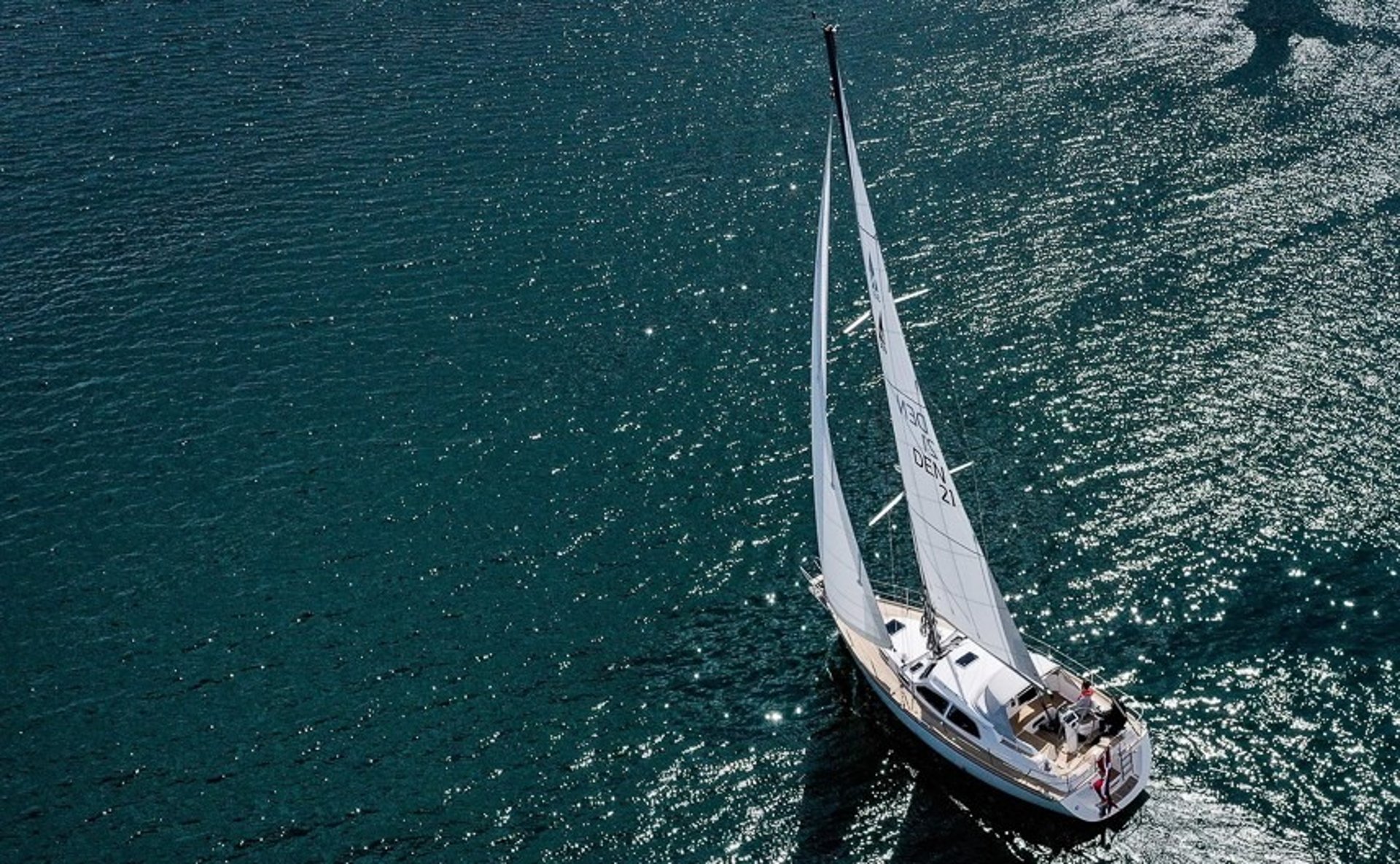 white and black boat on sea during daytime