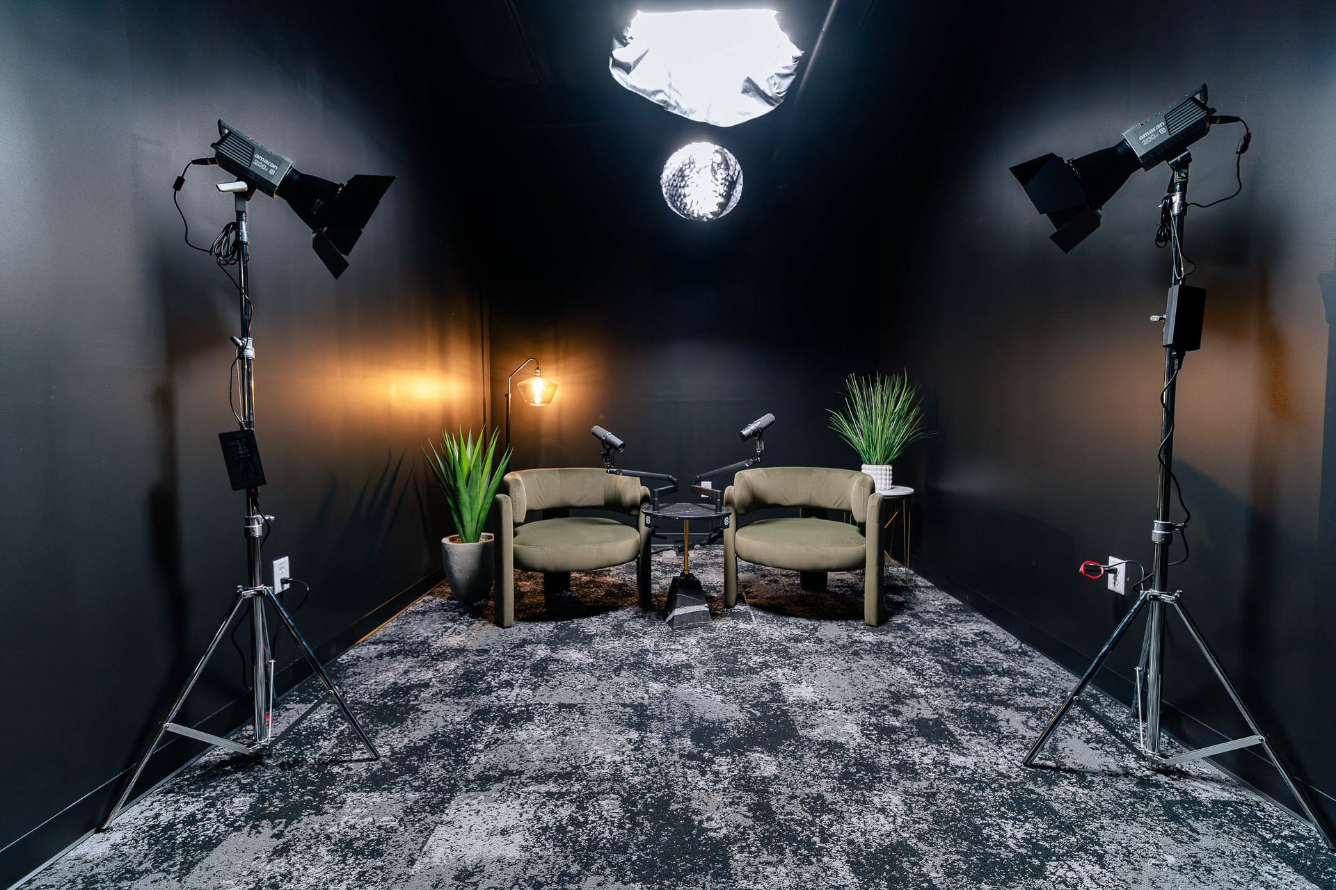 flat-lay photo of headphones, MIDI keyboard, and speaker on black surface