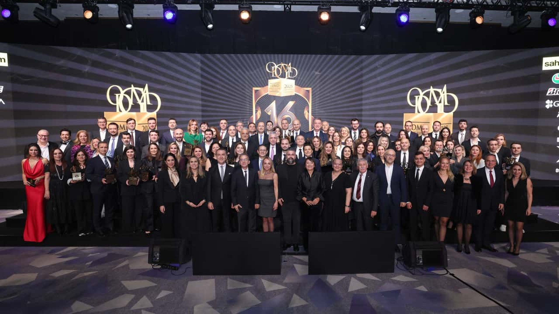man in white shirt standing beside black car