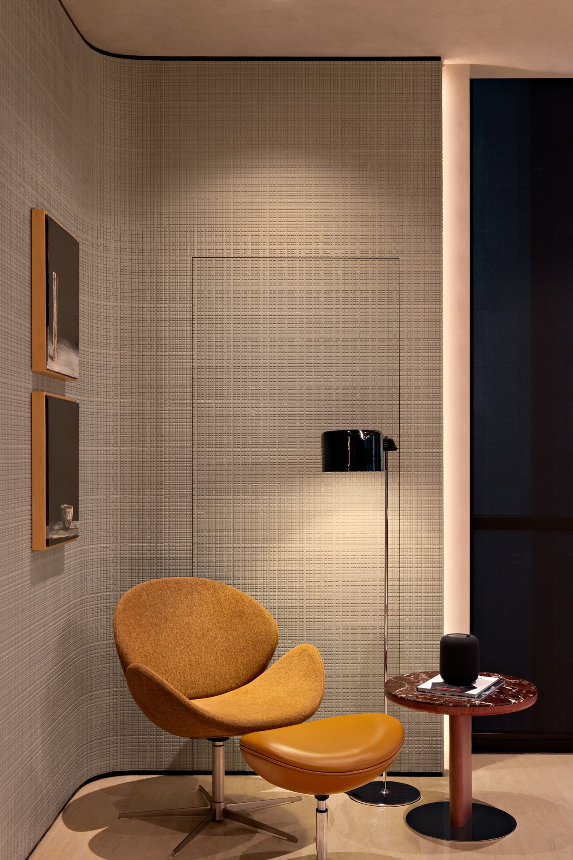 an abstract photo of a curved building with a blue sky in the background