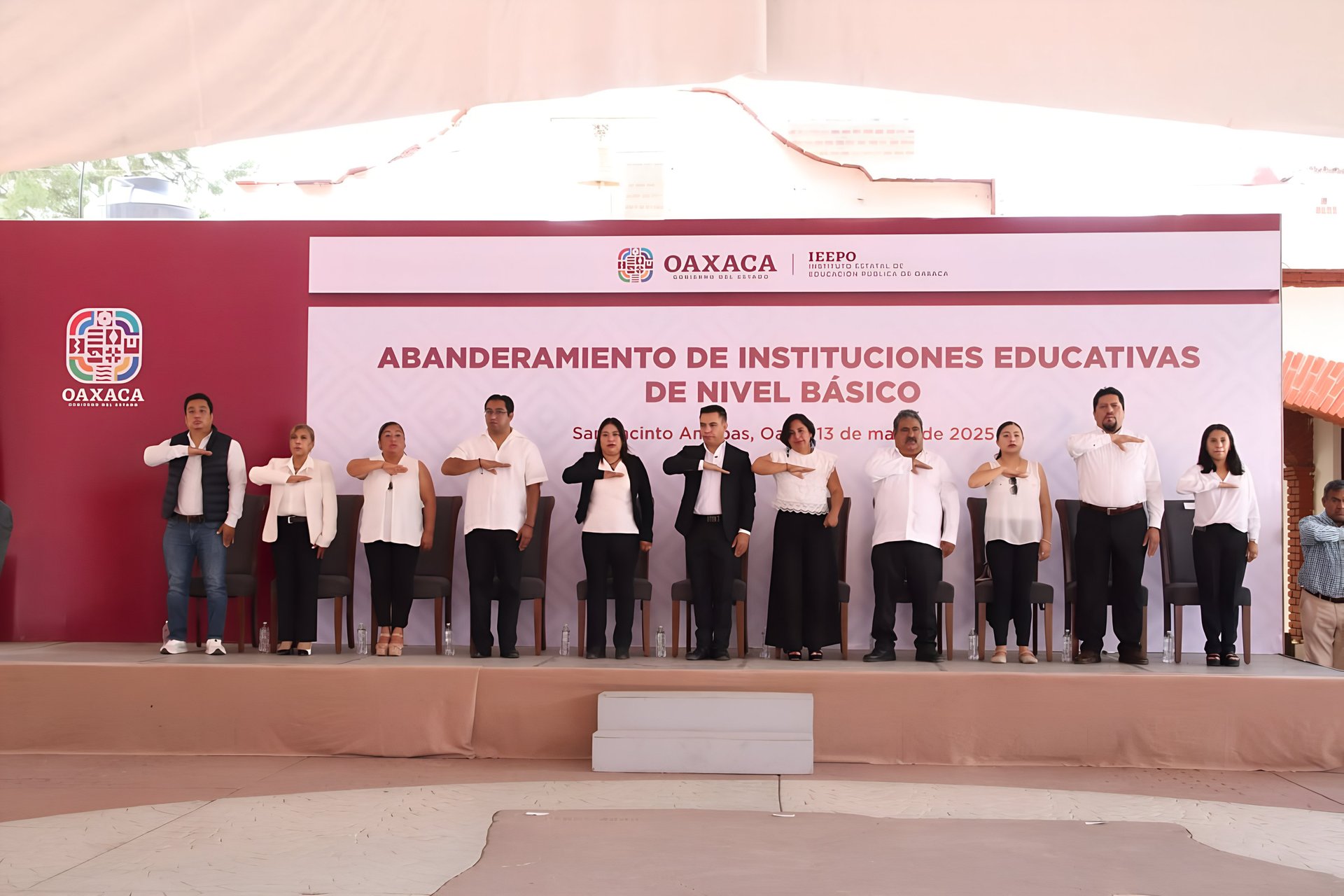 a large building with a dome and a courtyard with people walking around