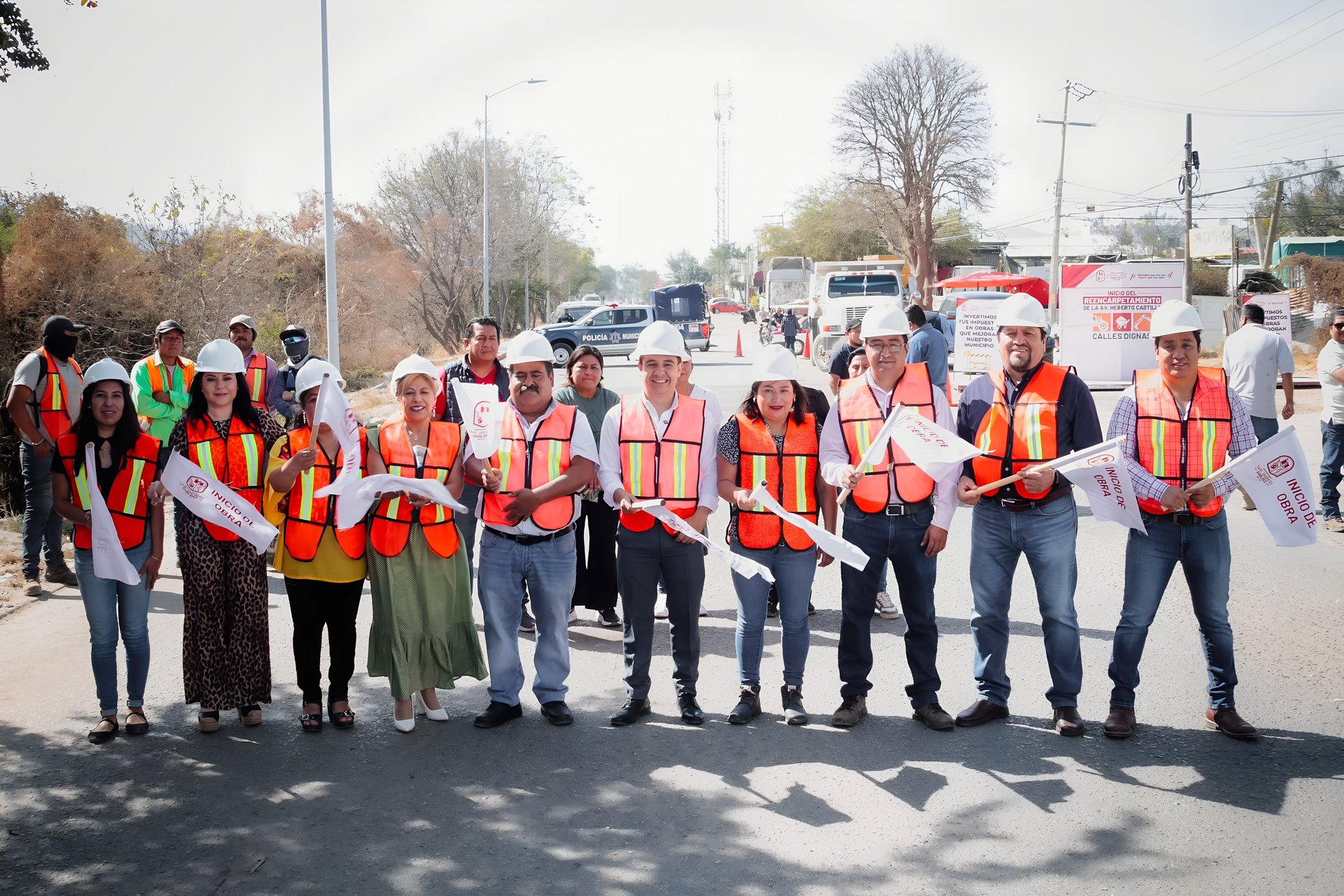 orange and white excavator on brown ground during daytime