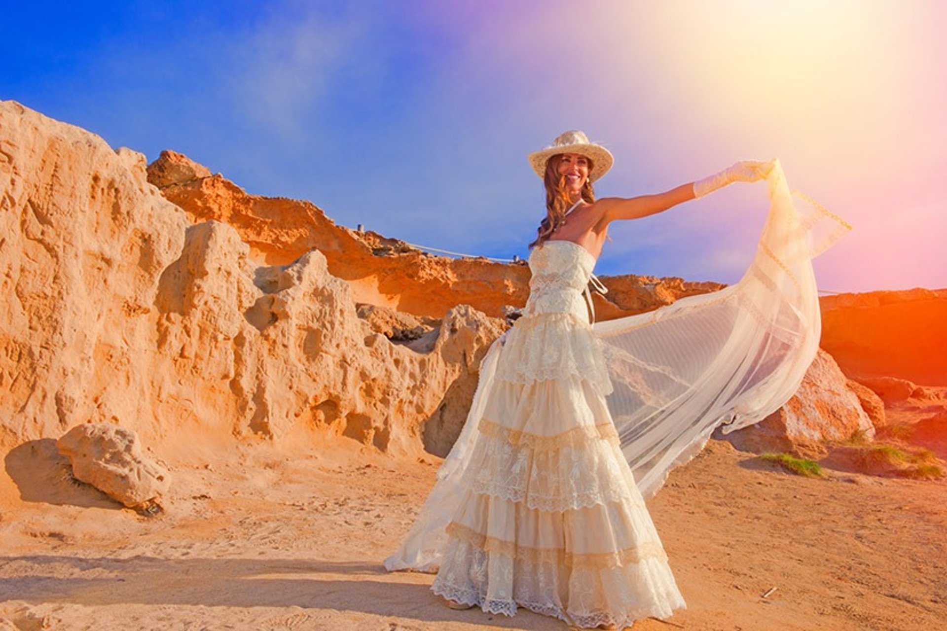 woman wearing yellow long-sleeved dress under white clouds and blue sky during daytime